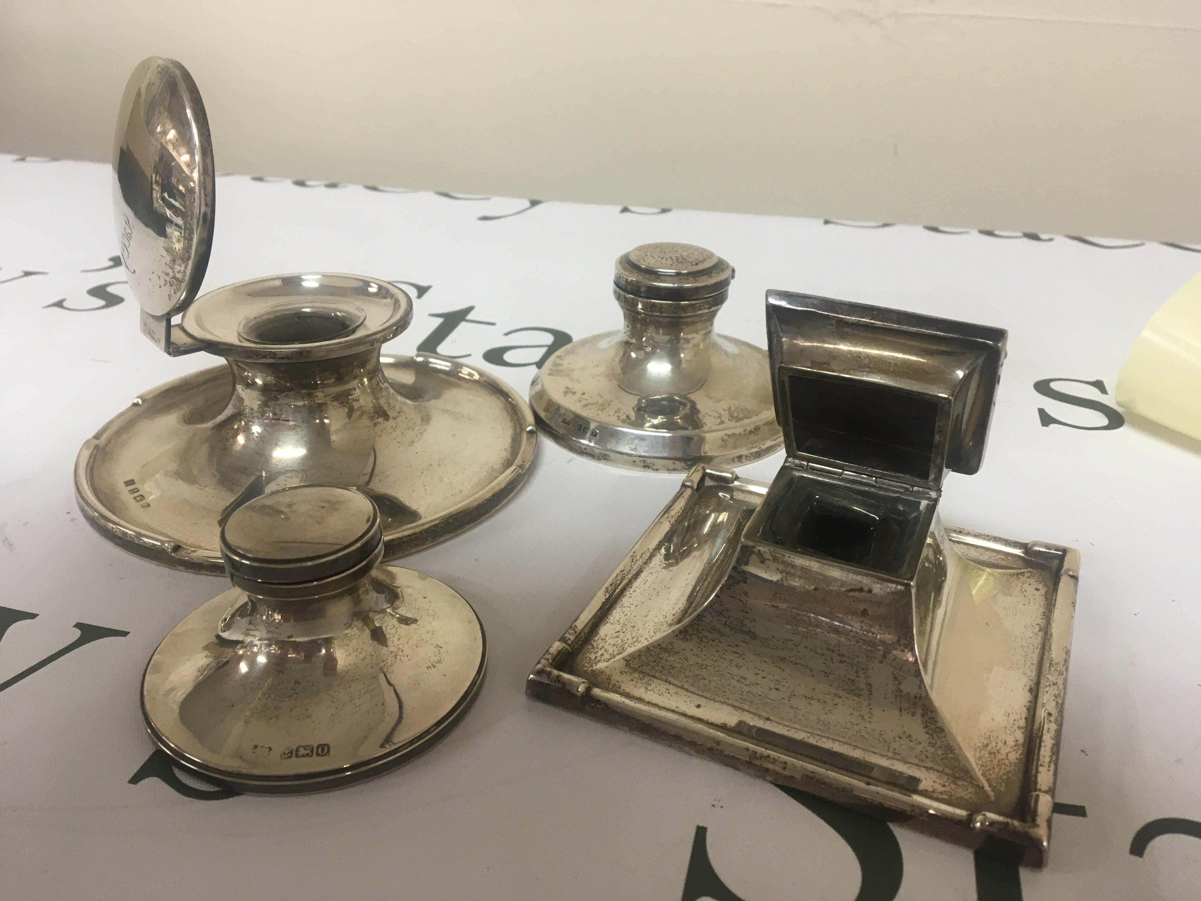 Four Silver Capstan type silver ink wells one of square shape with Birmingham 1921 hallmarks and three round ink wells (4)
