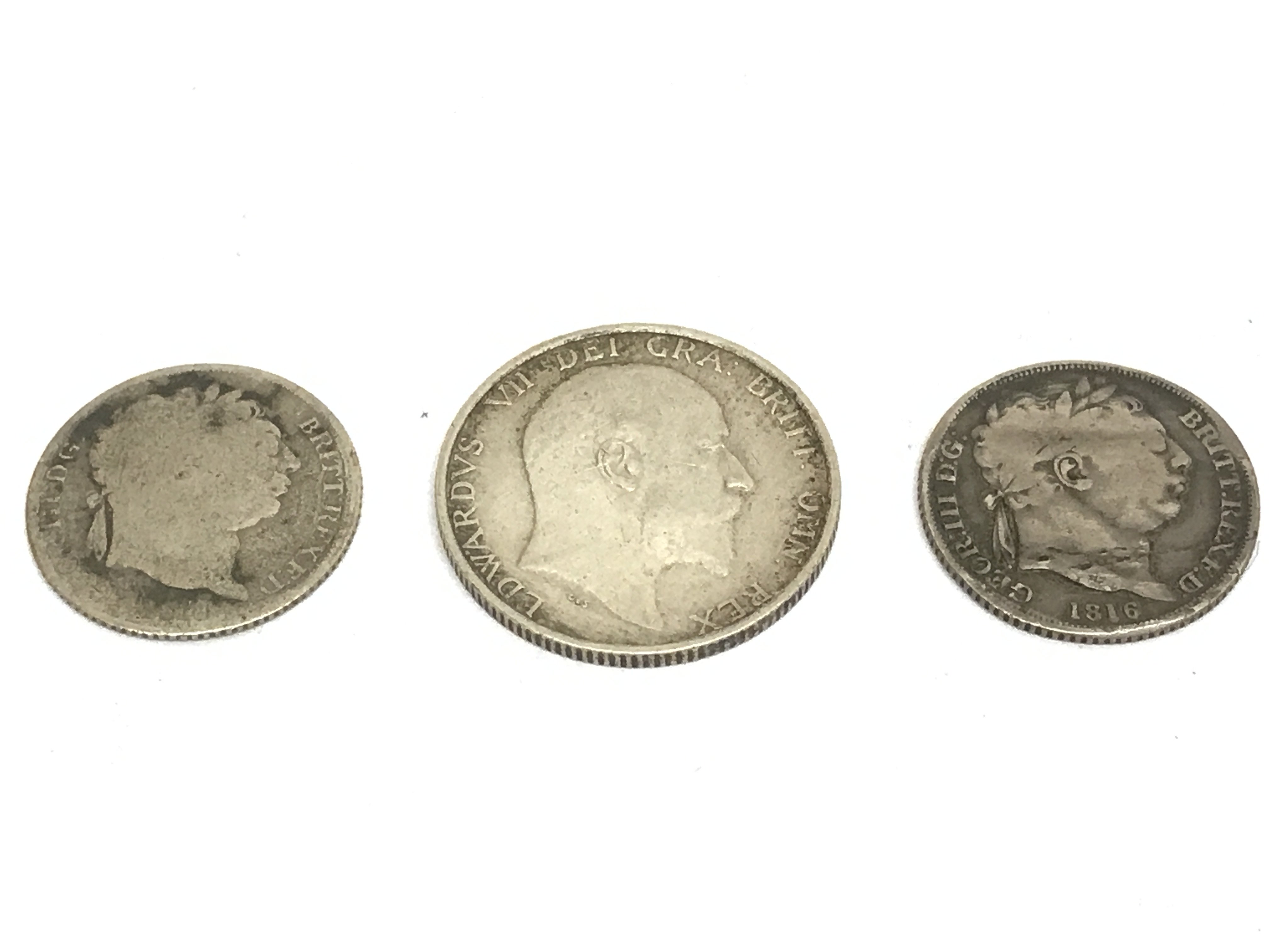 A 1910 shilling, 1816 six piece and another six pence . Postage category A- NO RESERVE