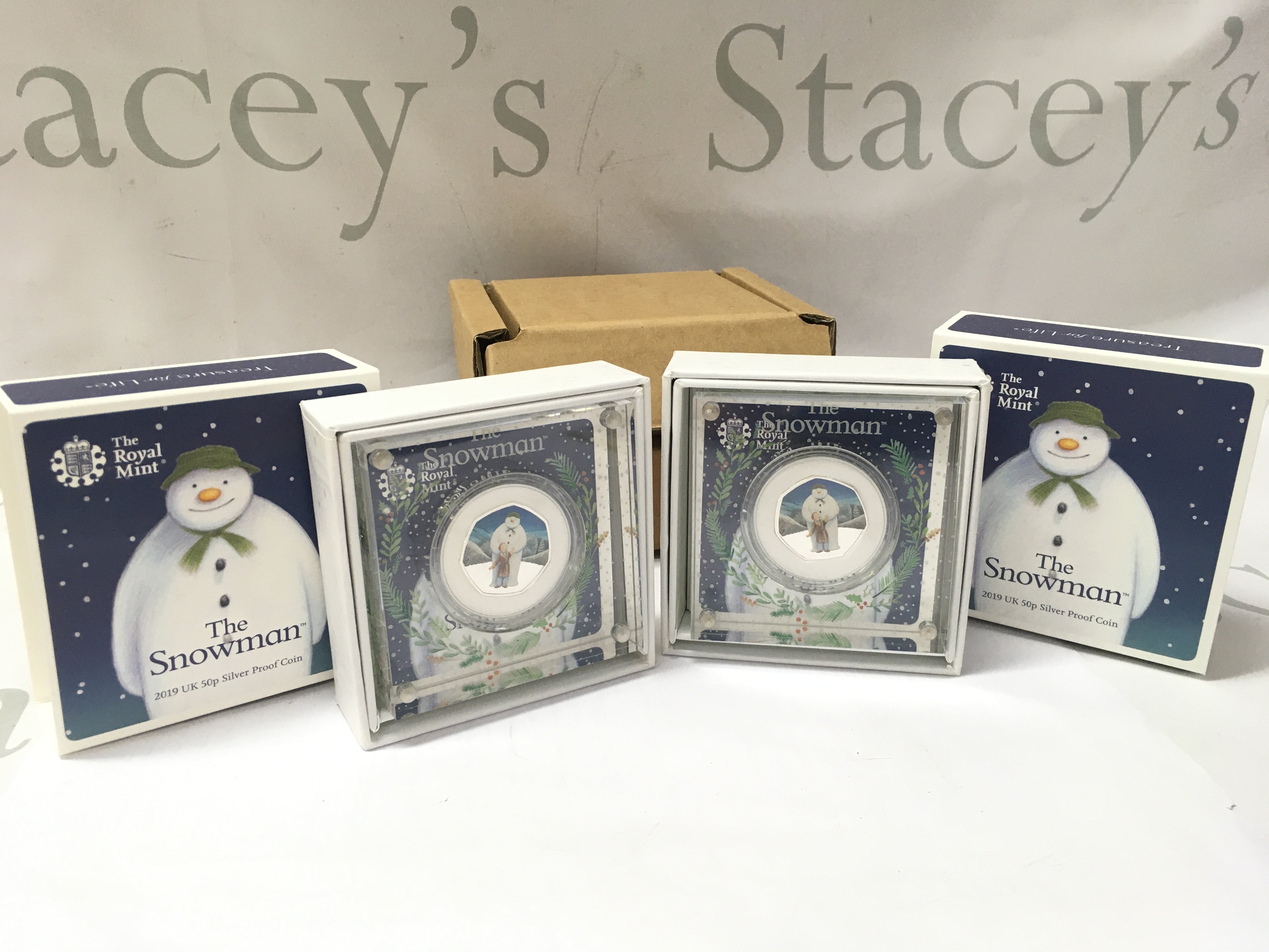 Two boxed Royal Mint snowman 2019 UK 50p silver proof coins . Postage category B