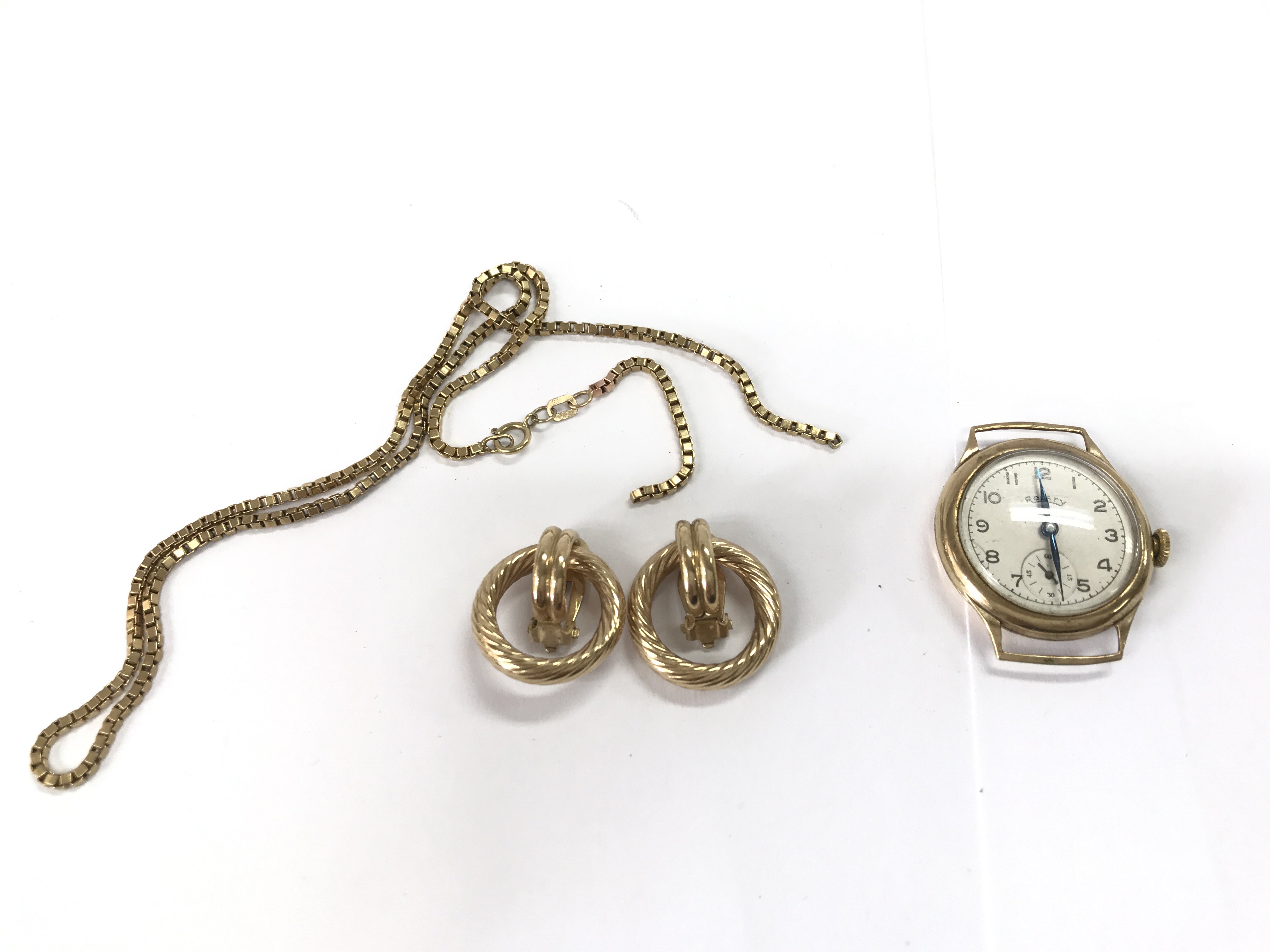 A pair of 9ct gold earring and a 9ct gold chain A/F 12.10g and a 9ct cased rotary watch 16g Postage B