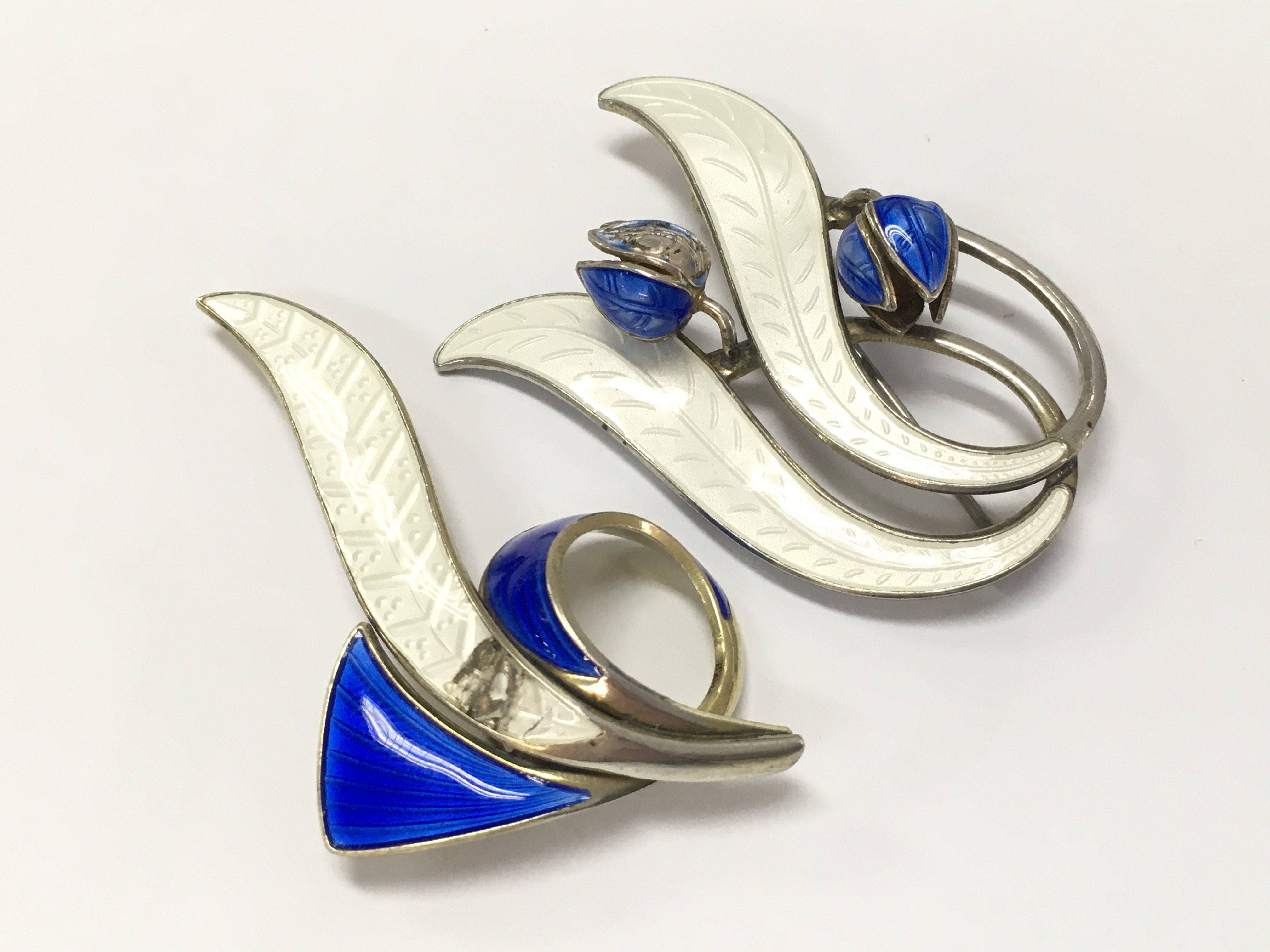 Two damaged Sterling silver Norwegian enamel brooches . Postage category A