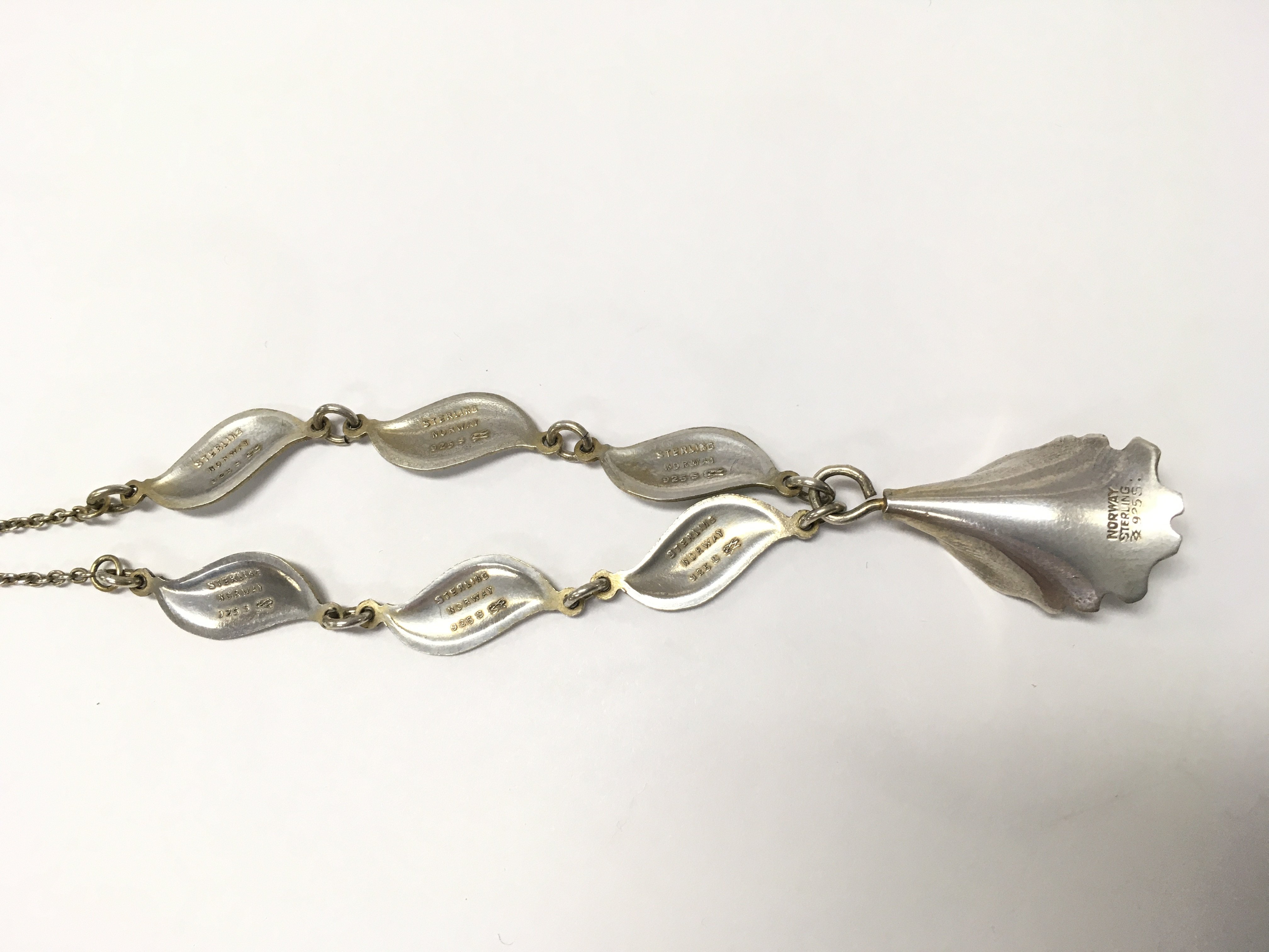 Norwegian silver necklace and a pair of silver white enamel clip on earrings, postage category A