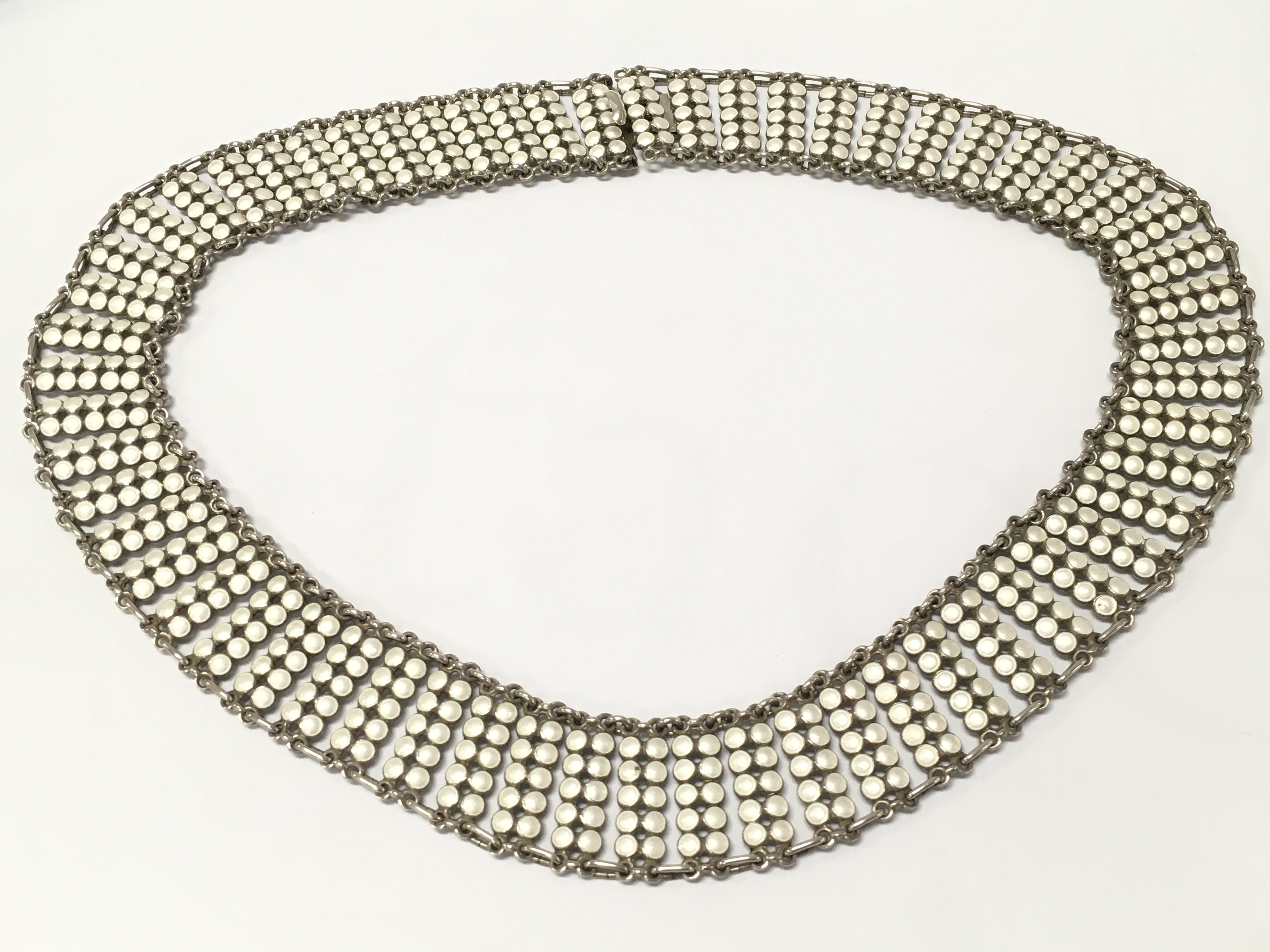 A Norwegian silver and white enamel necklace, 20cm long . Postage cat A