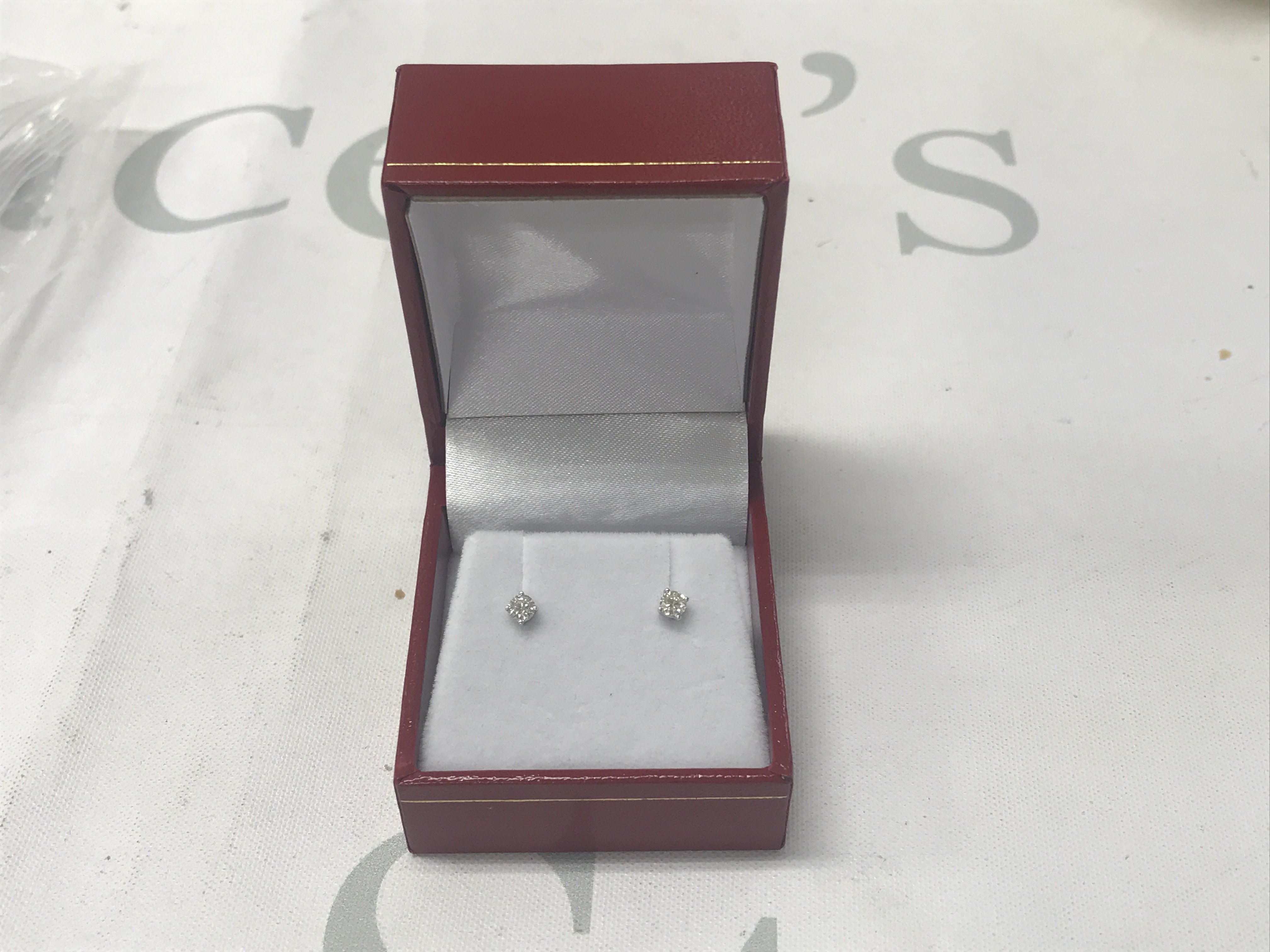 Pair of 18ct white gold 4-claw set diamond solitaire studs, boxed. Diamonds 0.28ct.