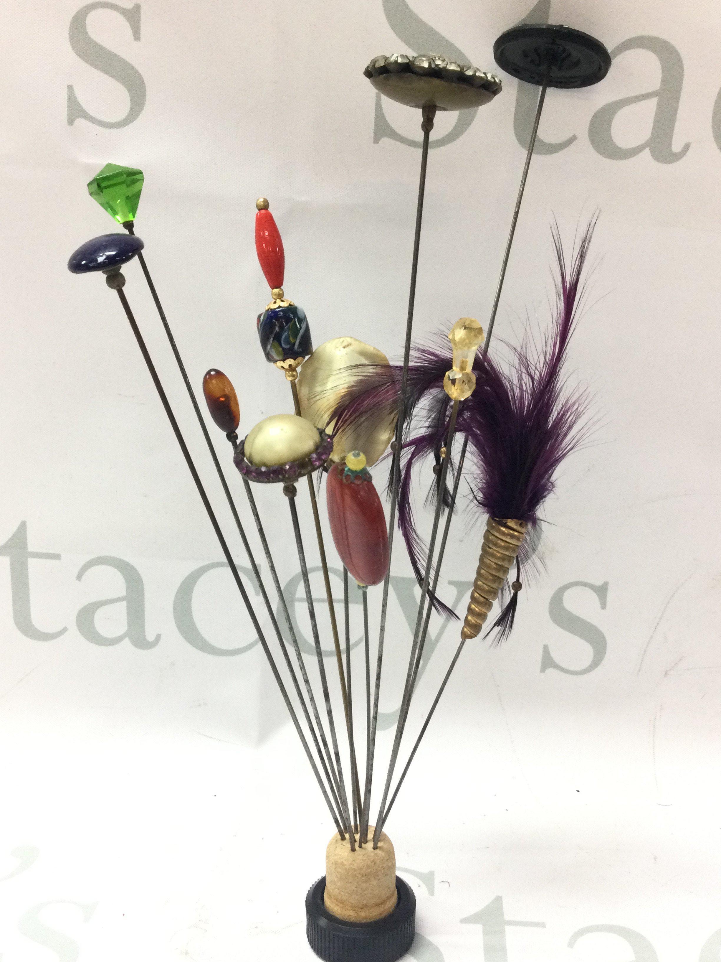 Eleven Victorian mainly long hat pins. Postage category B