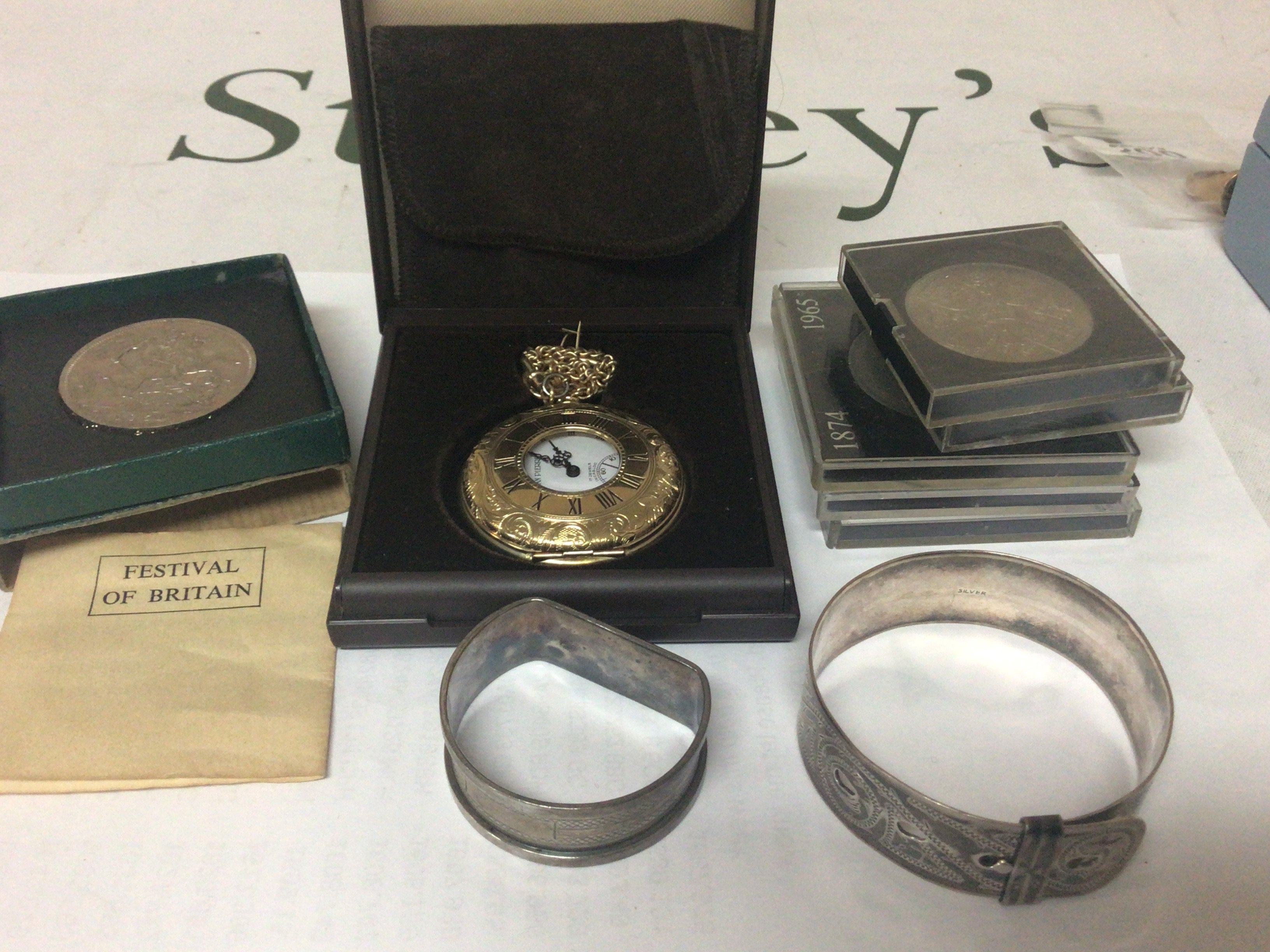 A silver buckle bangle napkin ring gold plated pocket watch and coins