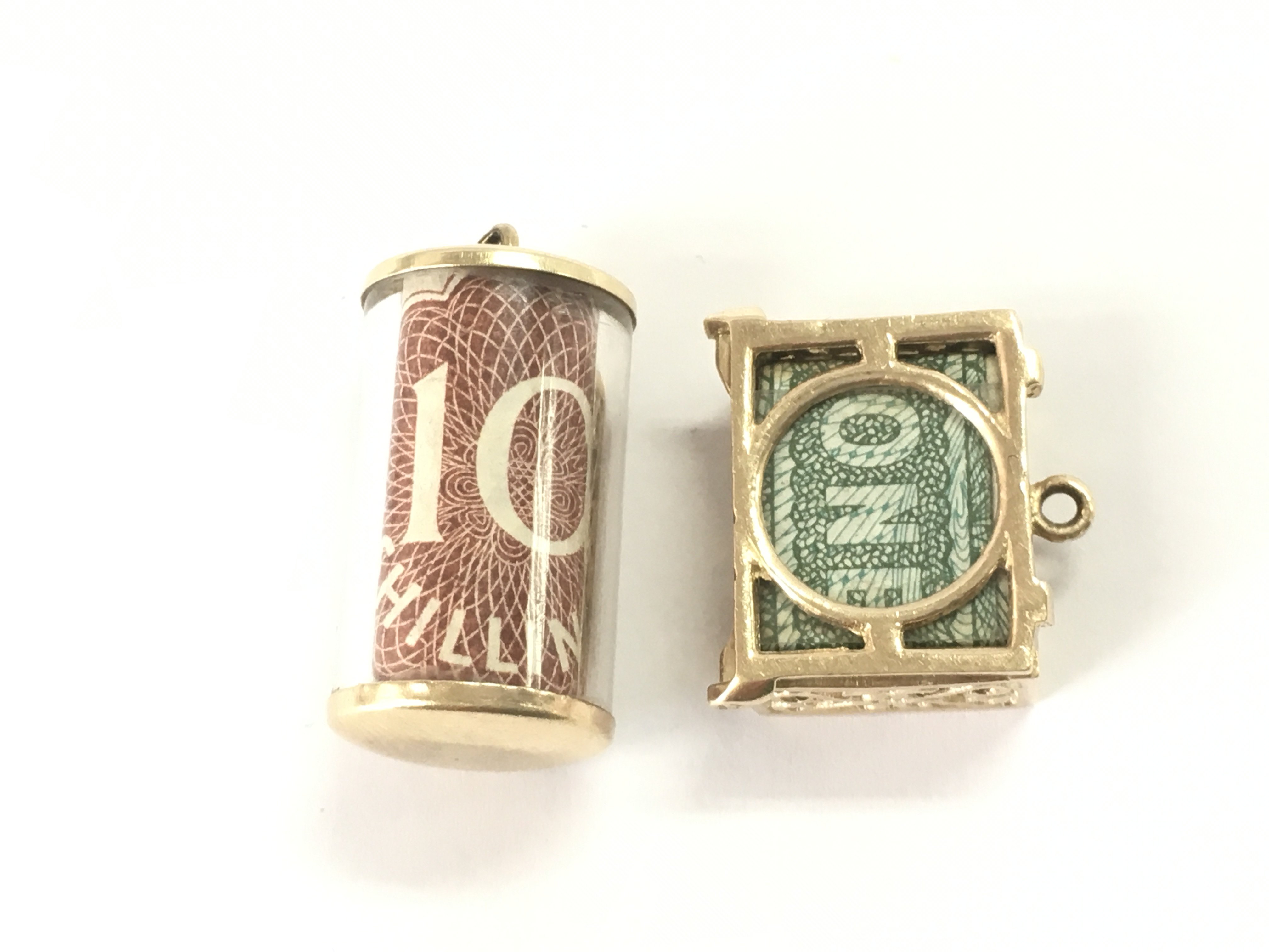 Two vintage 9ct gold charms both containing old English bank notes.