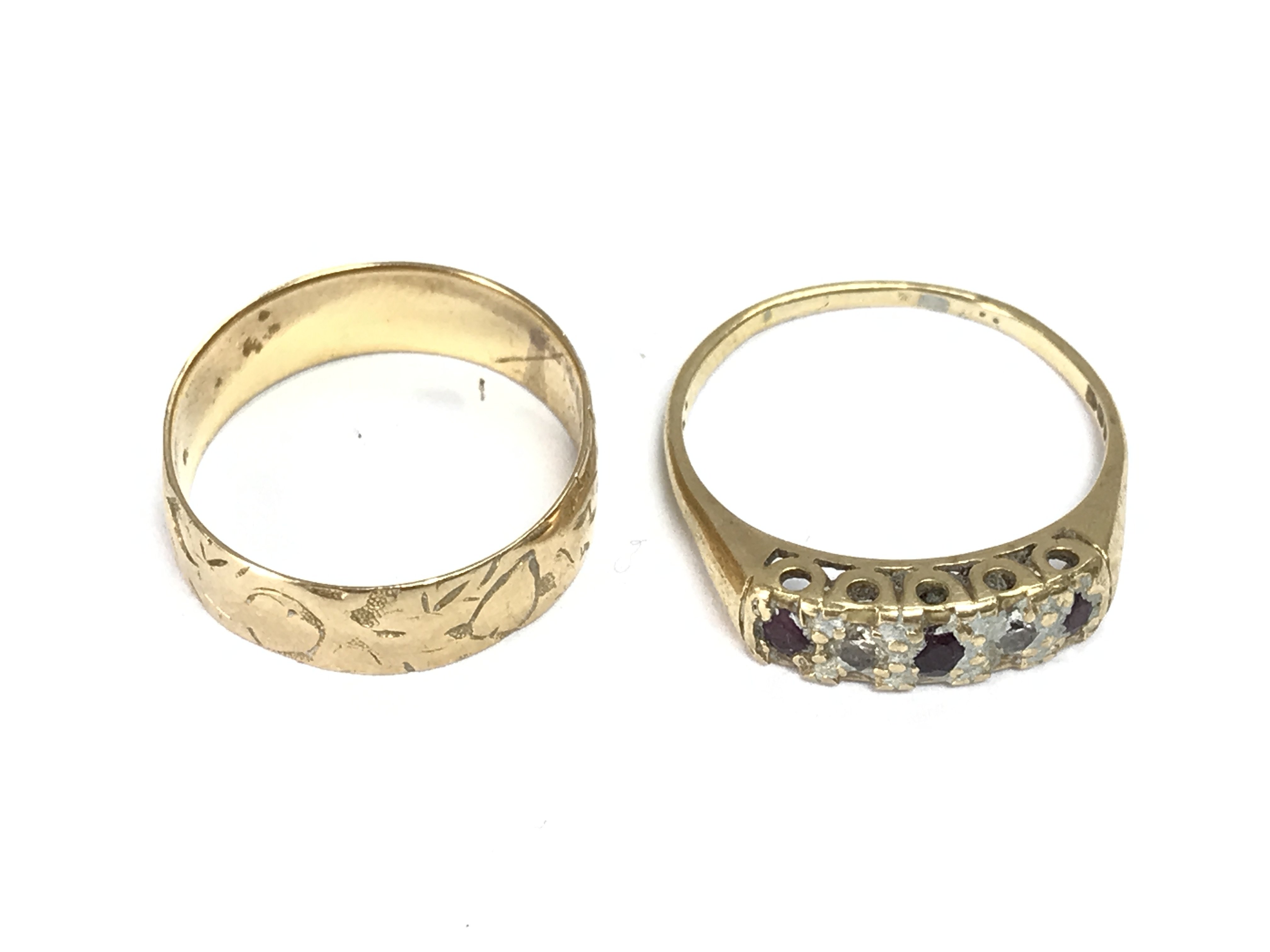 Two 18ct gold rings. Sizes R and T 7.15g Postage A