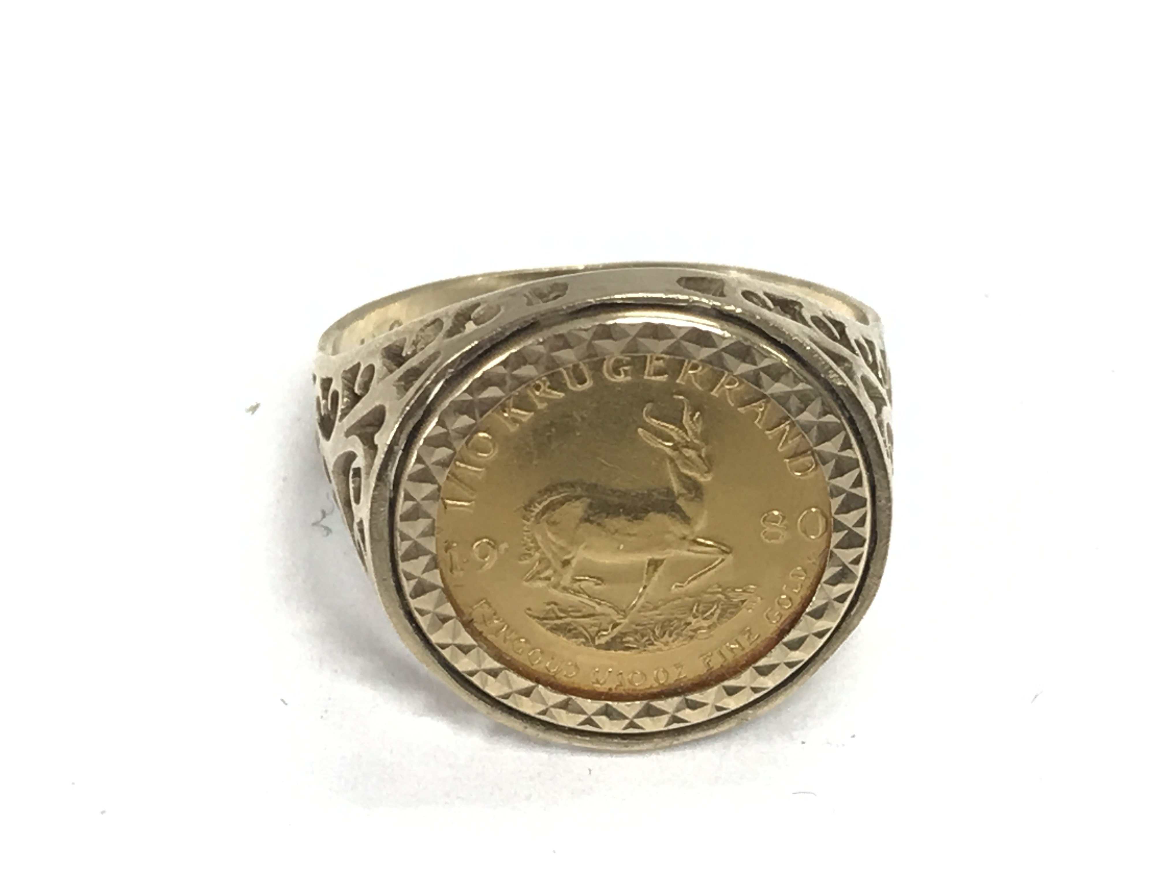A 1980 1/10th Krugerrand coin in 9ct ring mount. 6.29g and size S