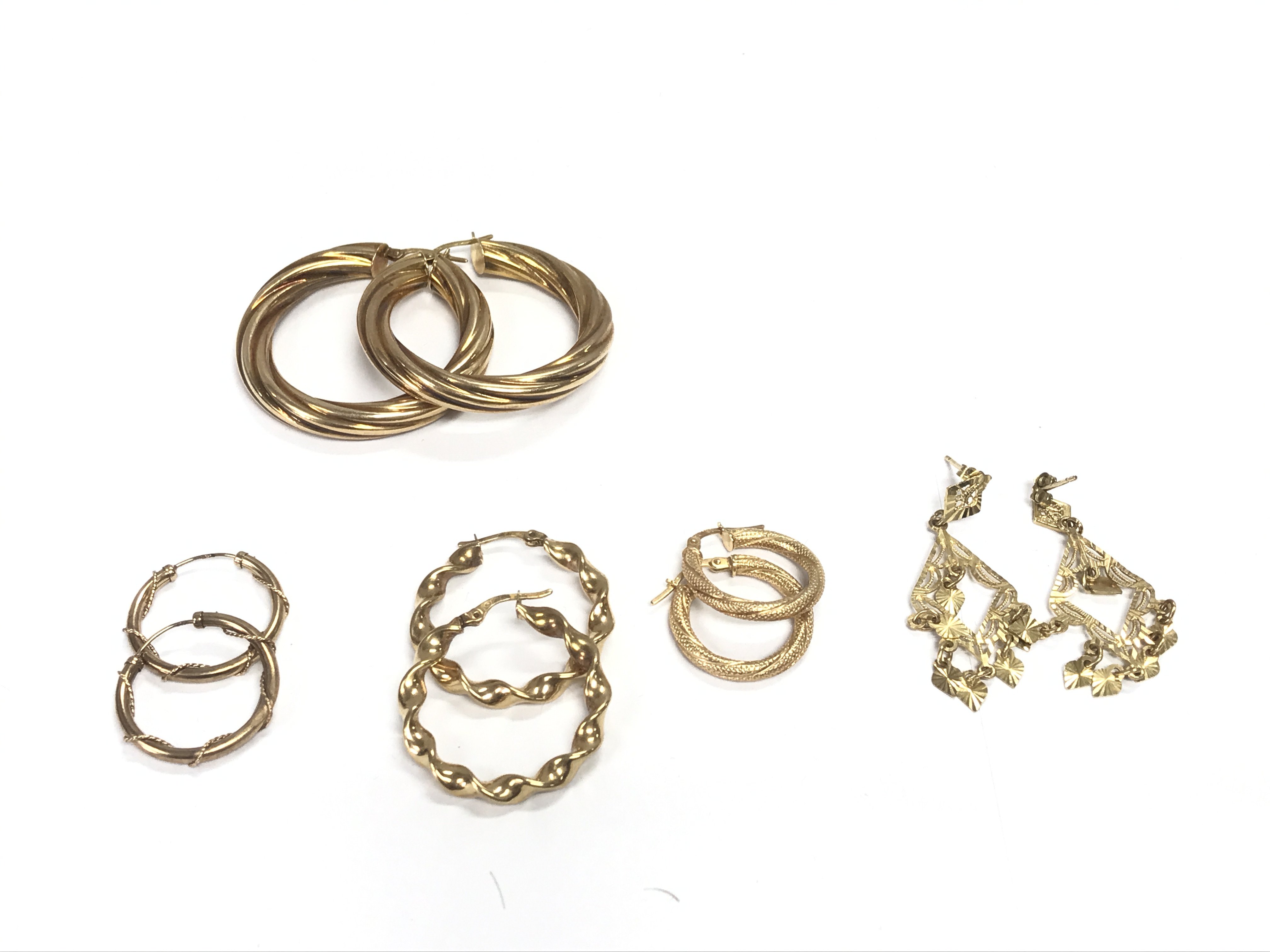 5 pairs of 9ct gold earrings. 14.20g