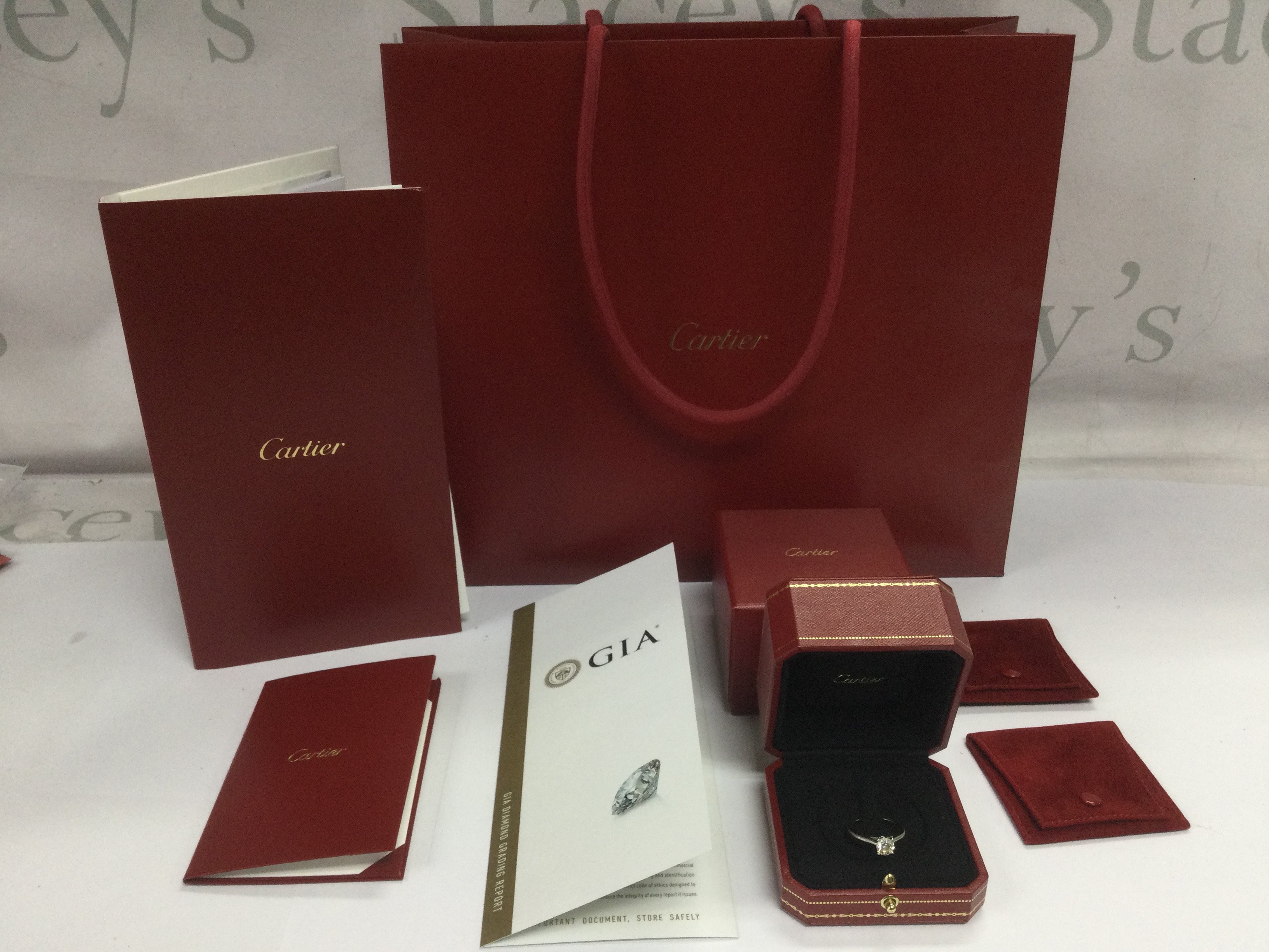 A Cartier 950 platinum diamond ring set with a 1.06ct round brilliant cut solitaire diamond. Colour H, Clarity VVS1, approx 6.28ct and approx size N-O. Comes with all outer packaging and GIA certificate. Shipping category B.