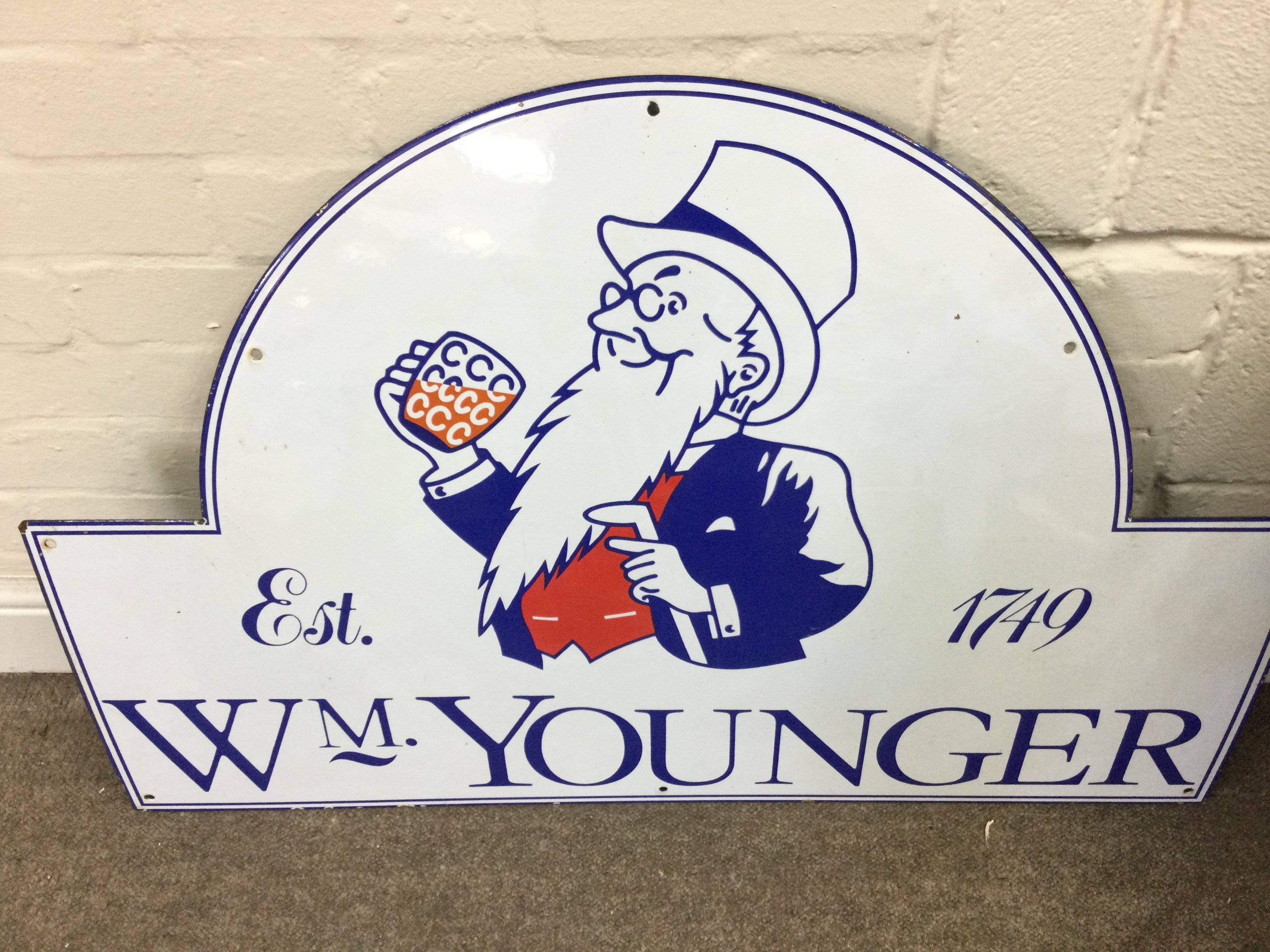 A vintage enamelled Wm Younger sign 36 x 24 inches approximately