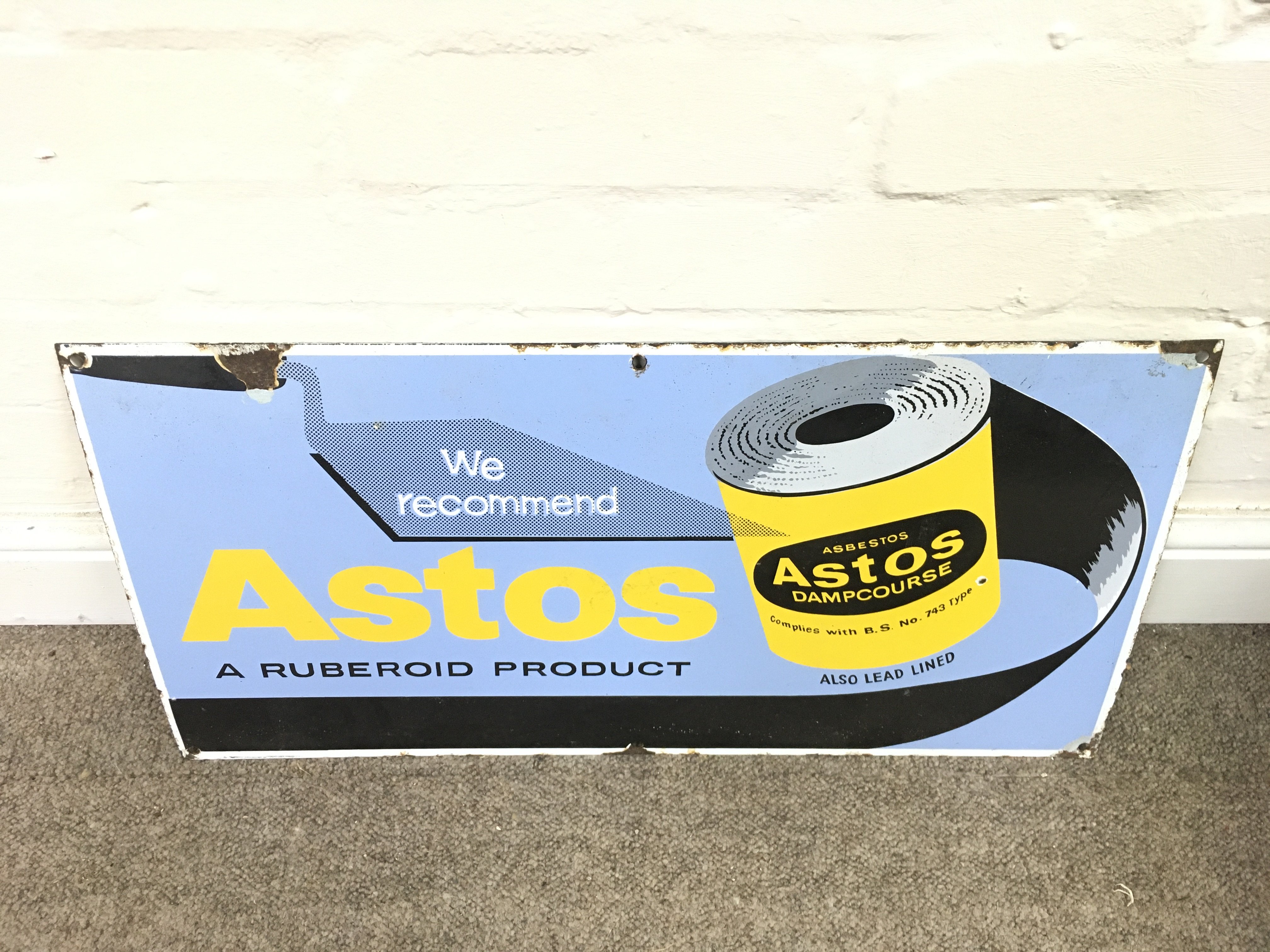 vintage enamel sign for Astos Dampcourse. 24 x 12 inches approximately