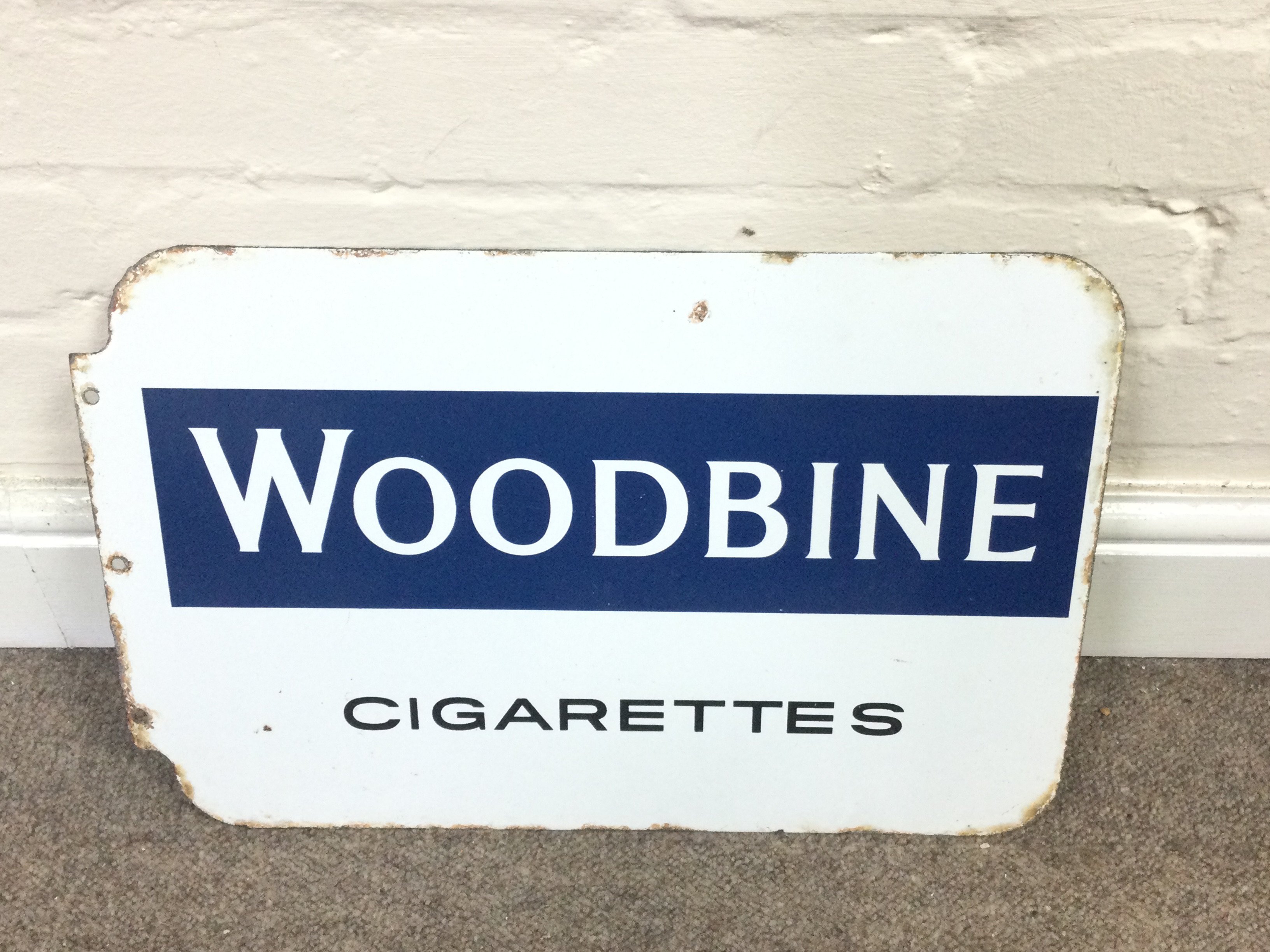 A double sided cigarettes sign advertising woodbine and golden Virginia 18 x 12 inches approximately