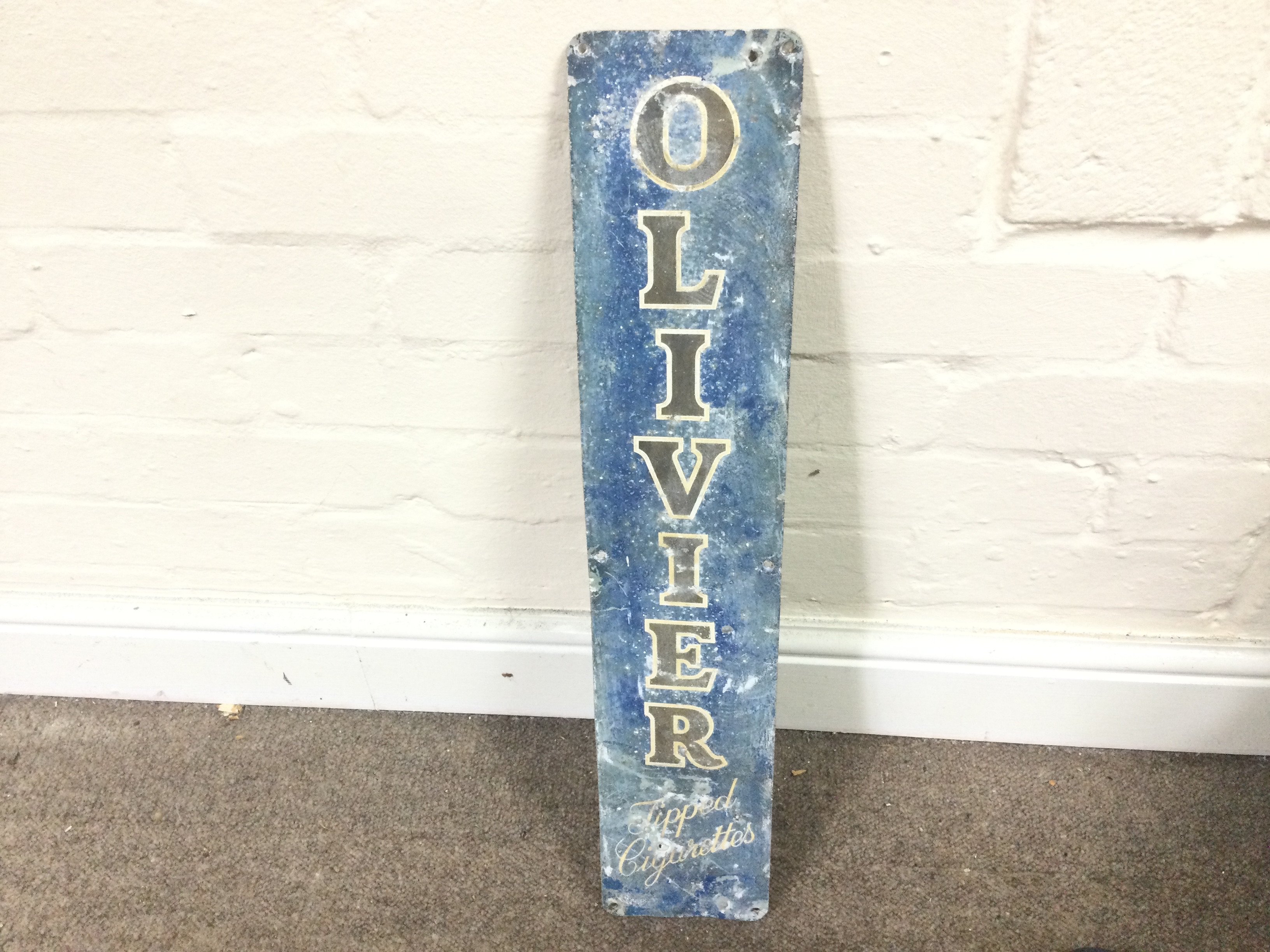 A vintage Olivier cigarette sign 24 x 5 inches approximately