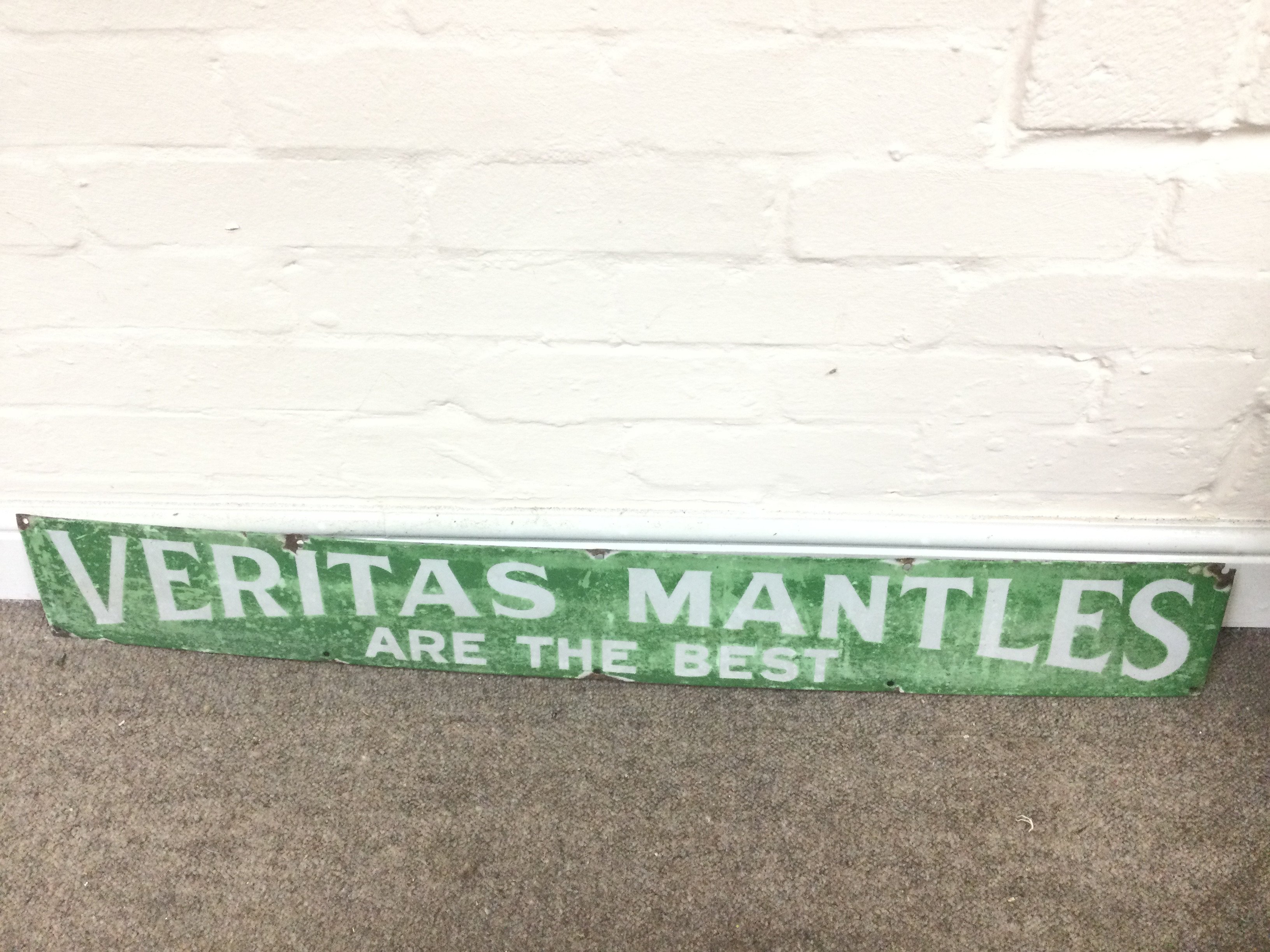 ENAMEL SIGN 'VERITAS MANTELS' 39 x 5.5 inches approximately
