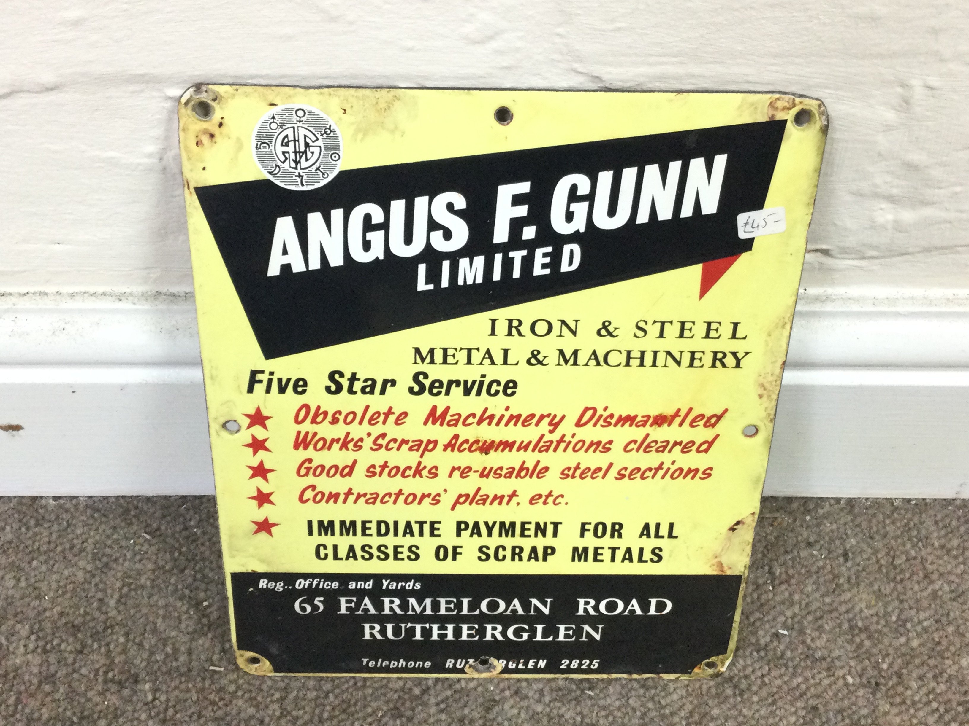 Angus F.Gunn limited iron and steel metal and machinery sign. 7.5 x 9.5 inches approximately