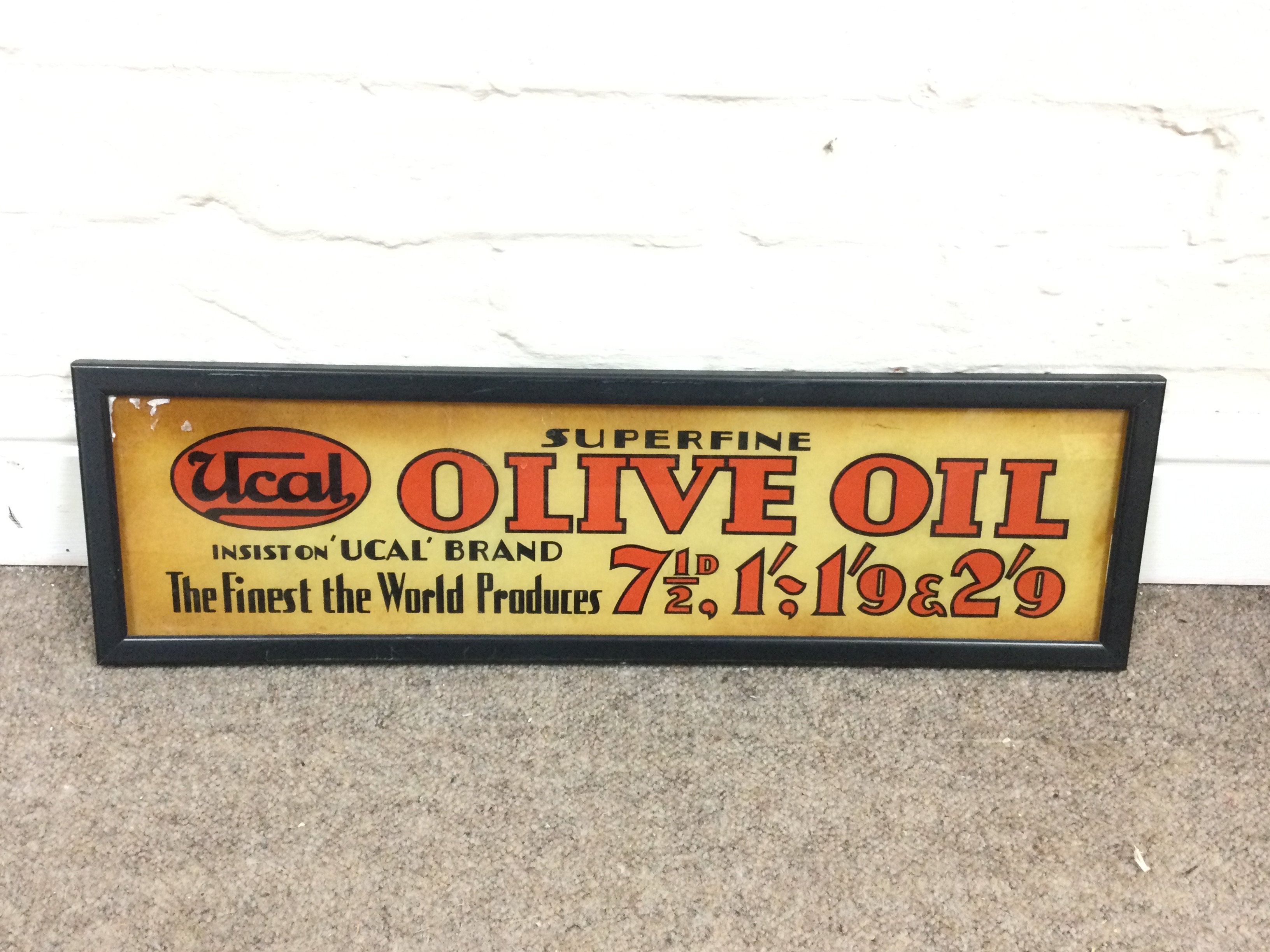 A Ucal 'Superfine Olive Oil' glass advertising sign 22 x 7 inches approximately