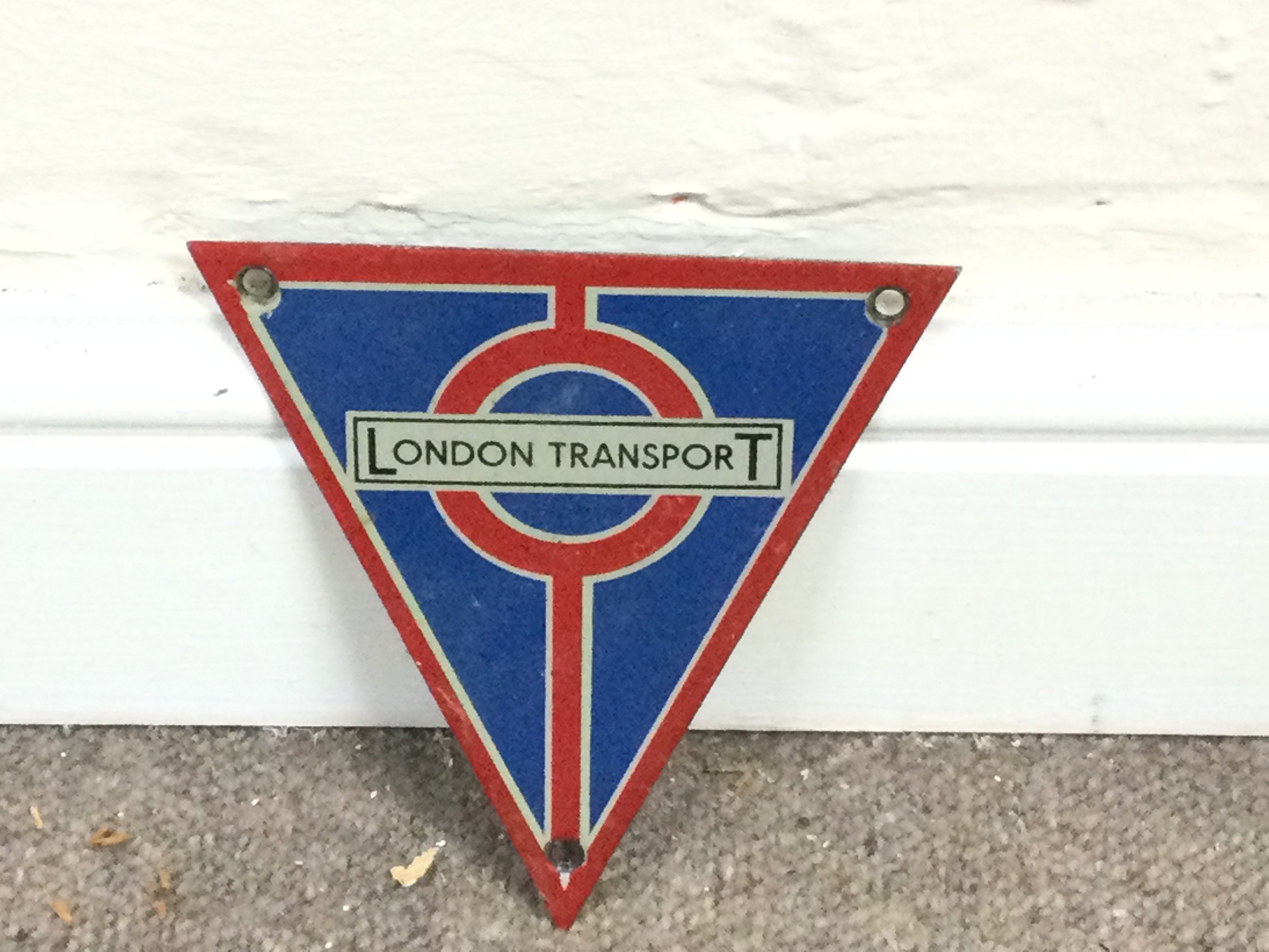 triangular-shaped enamel London Transport bus badges Approximately 5 inches
