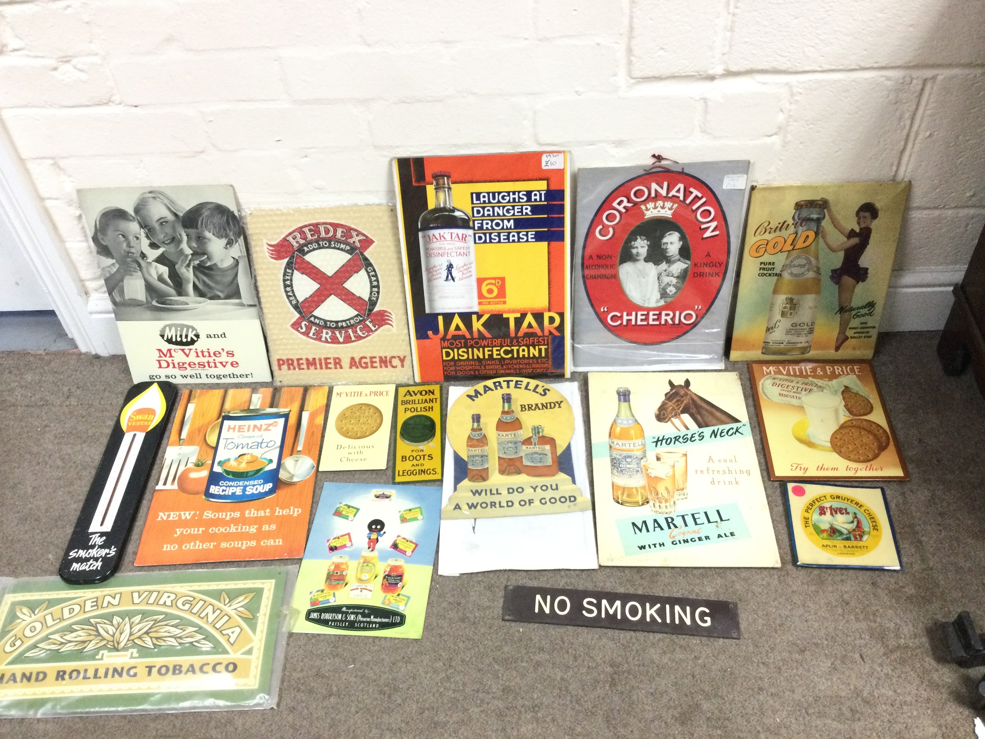 A collection of assorted advertising signs and cards.