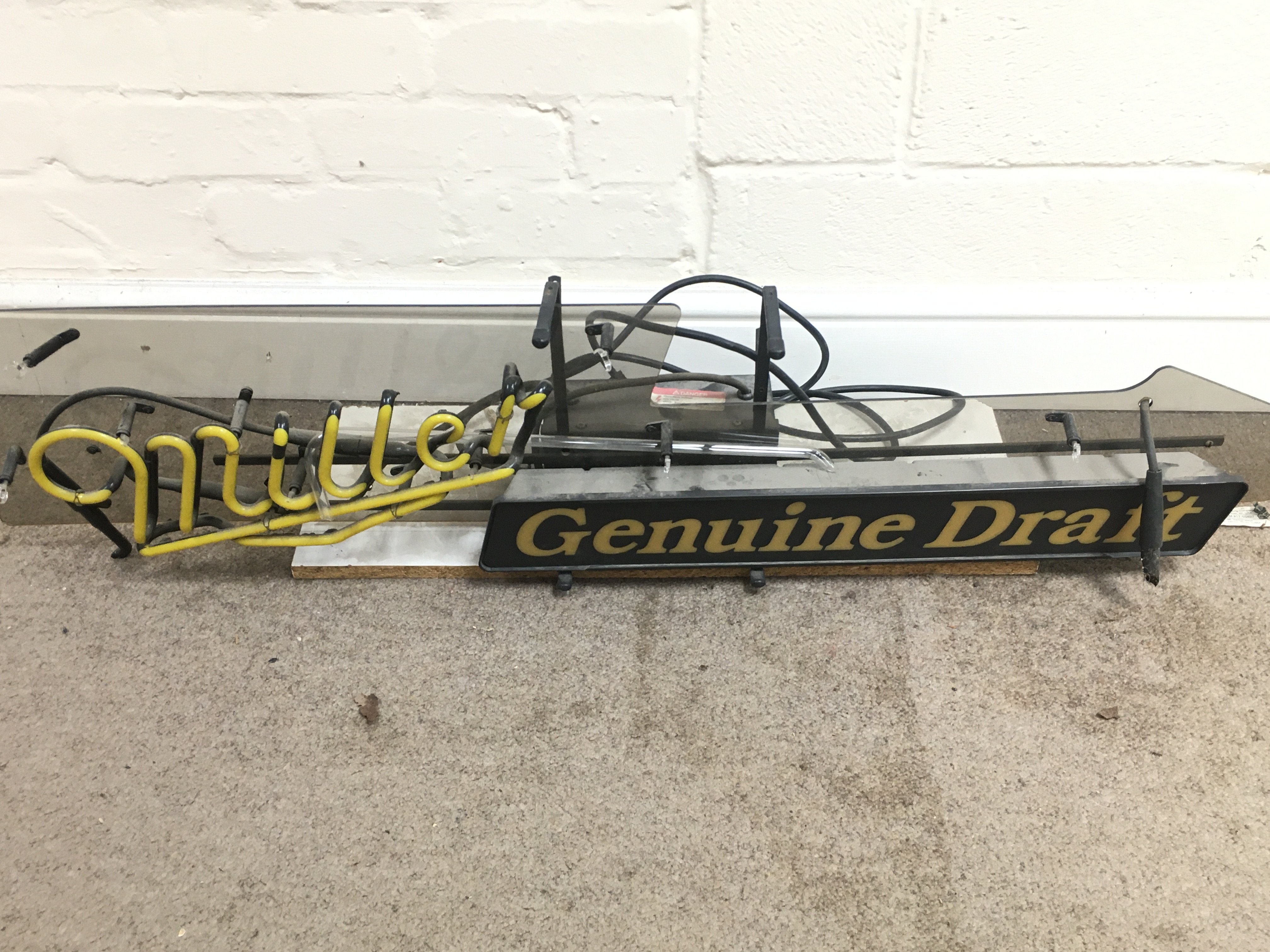 A miller draft neon sign A/F 43 inches wide.