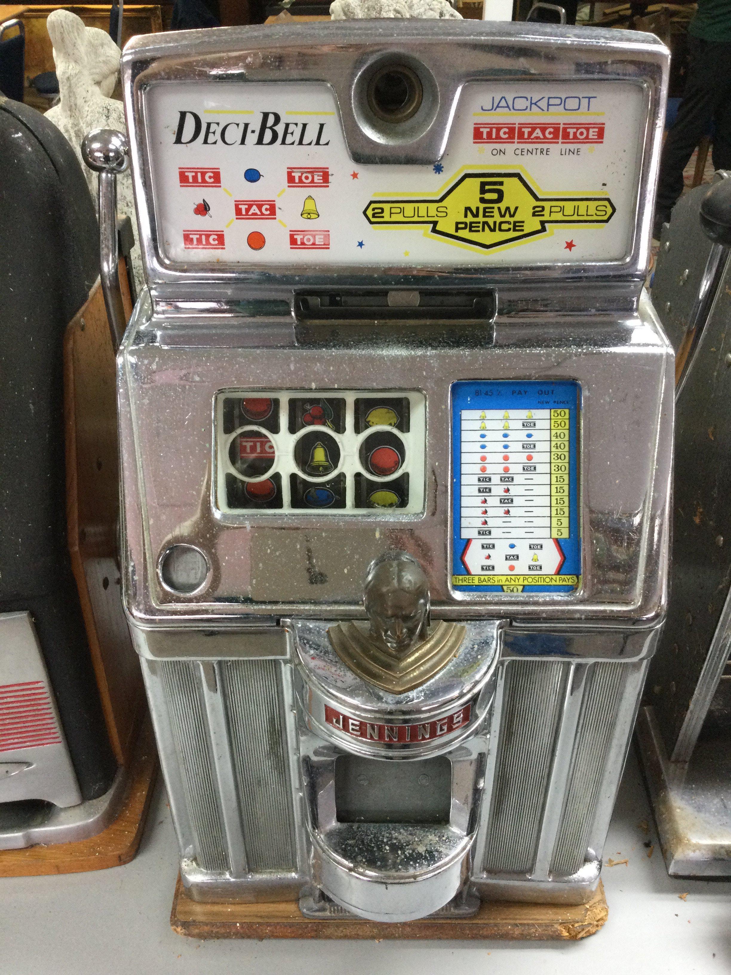 A 'Deci-Bell' (Jennings) one armed bandit 15 x 28 x 15 inches approximately