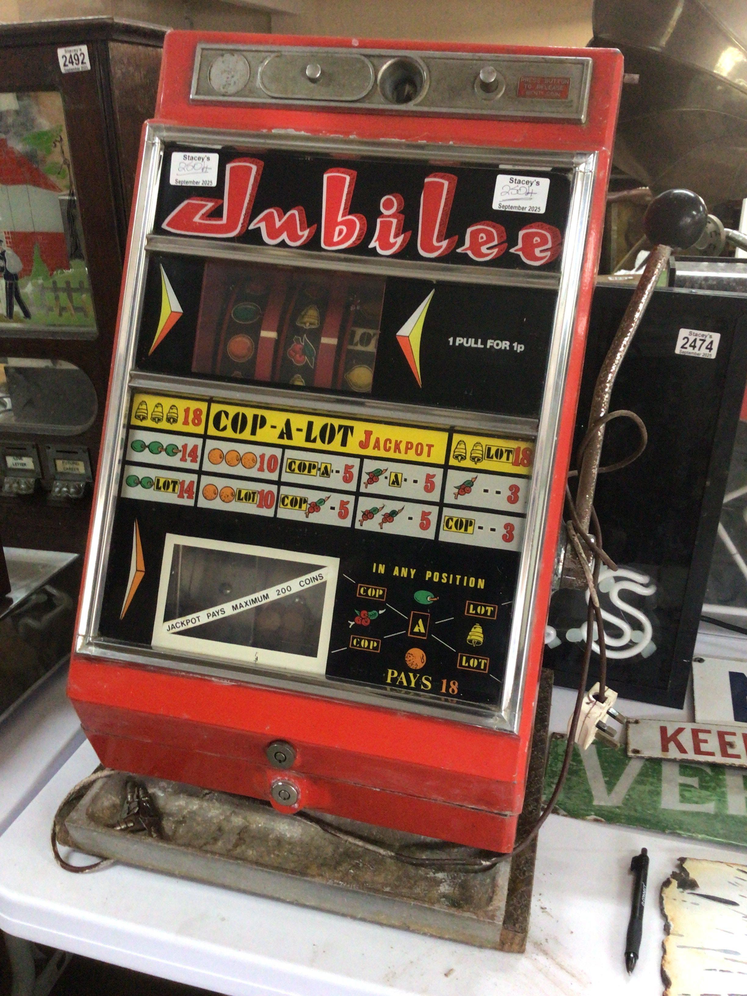 A Vintage Mechanical one arm bandit fruit machine The Jubilee set up for decimal 1p play jackpot 200 coins electric illumination. With case key. In need of refreshing.