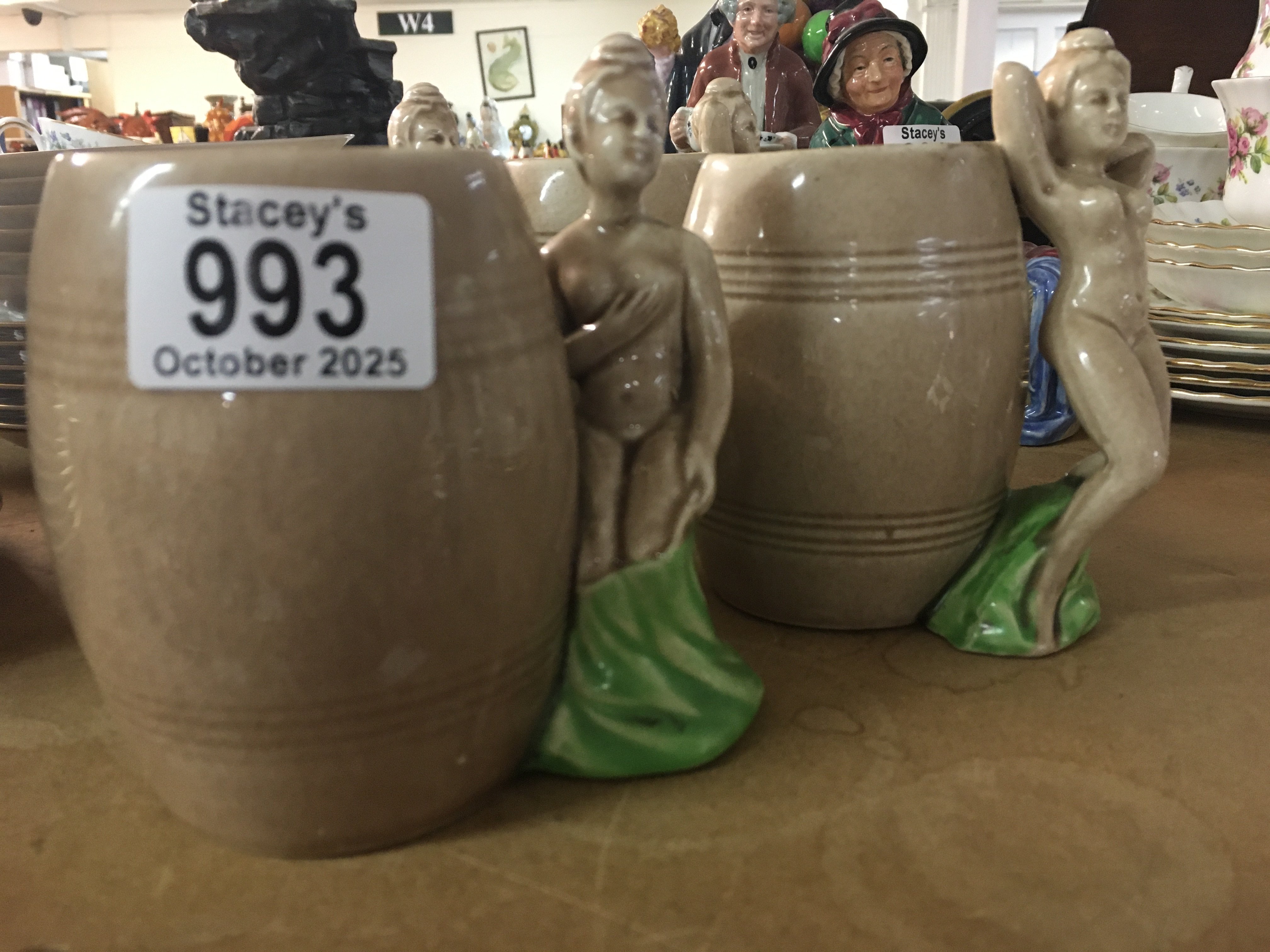 A set four Dorothy Kindell pottery mugs the handles in the form of nude maidens. NO RESERVE