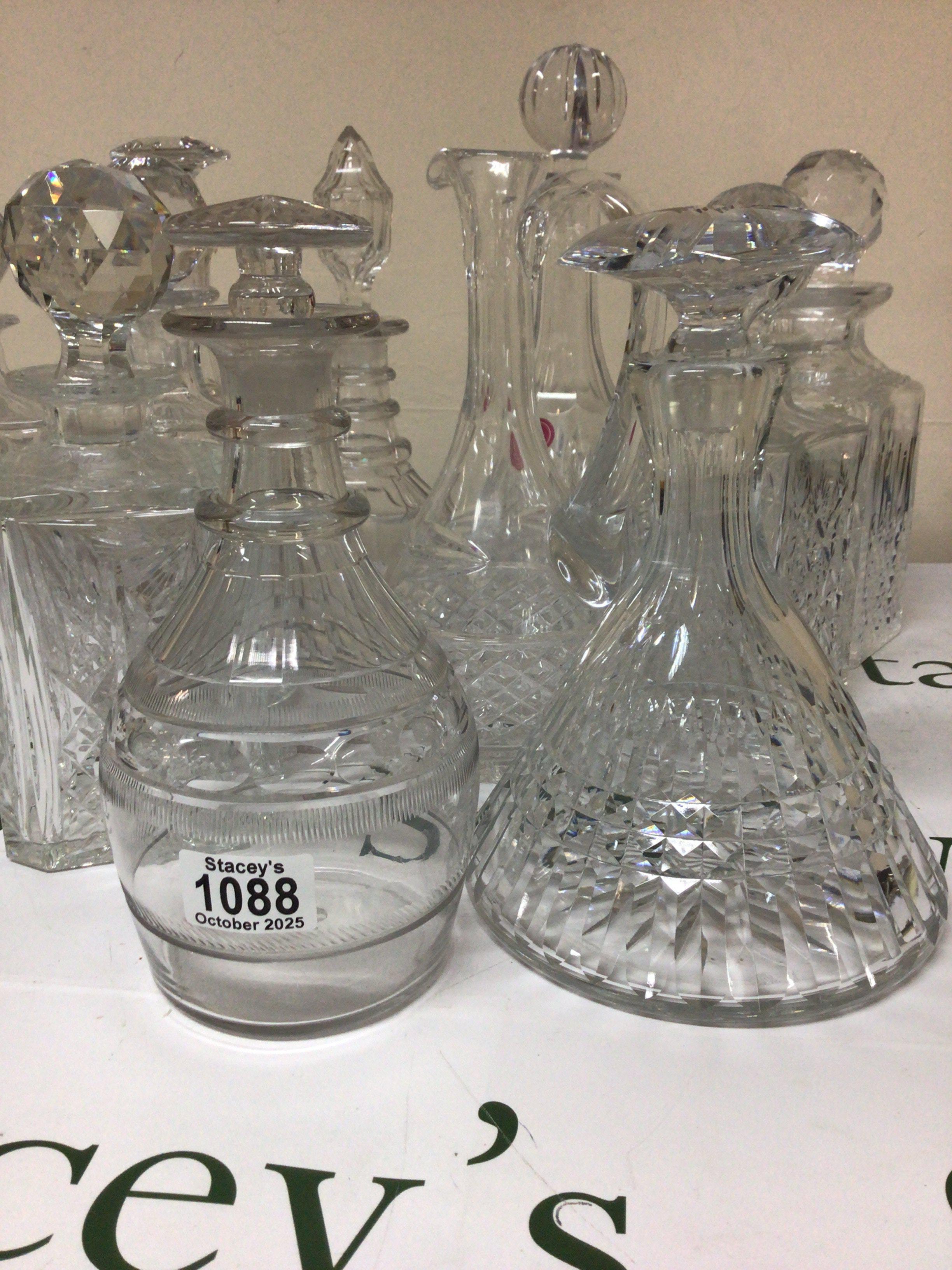 A good collection of cut glass decanters including a late George III decanter with a mushroom. Edinburgh Crystal and many others. NO RESERVE