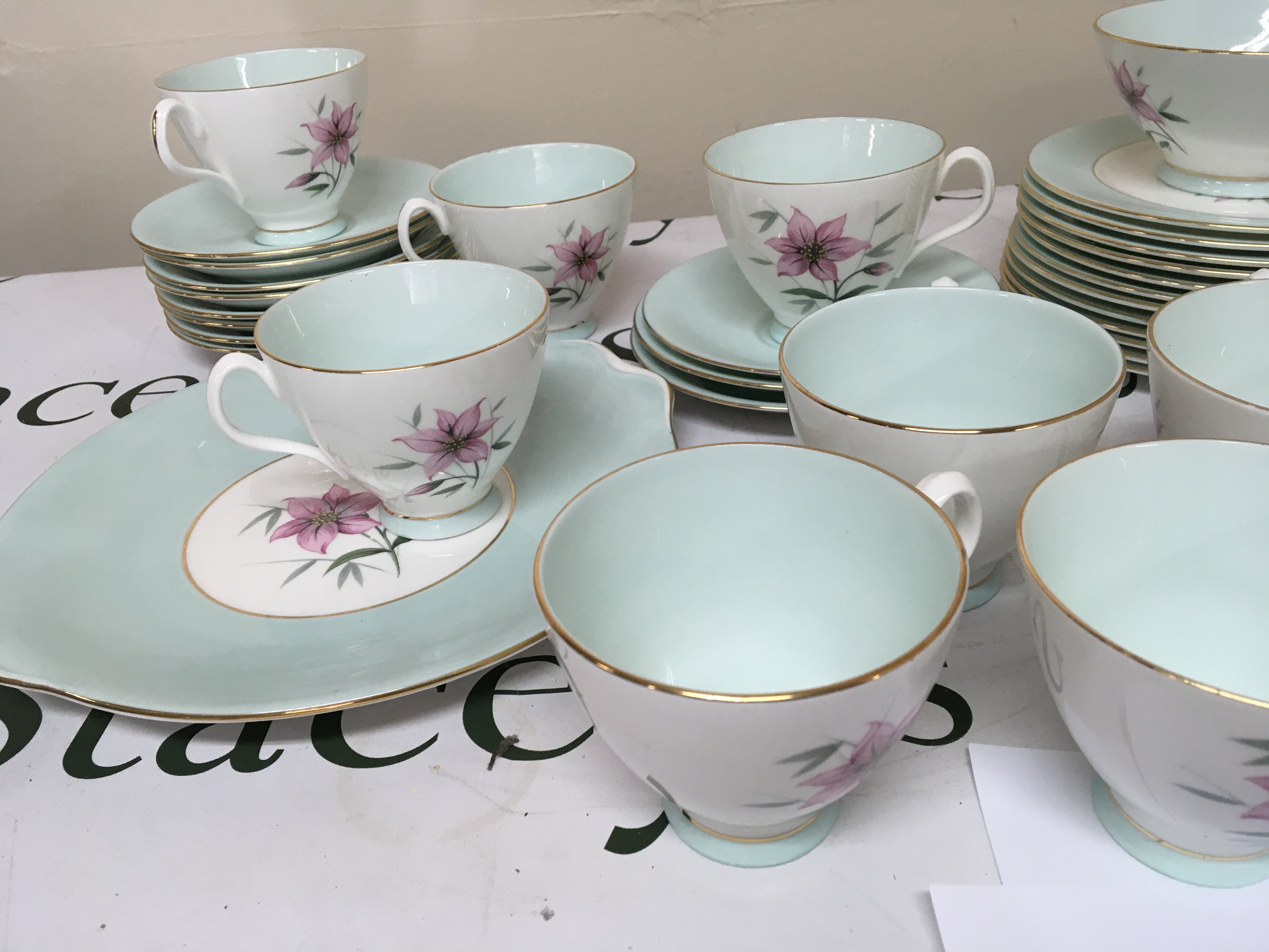 A Quality Royal Albert Bone China twelve place setting British tea set The Elfin pattern cups saucers side plates serving plate sugar bowl and cream jug. No Obvious Damage very good condition.