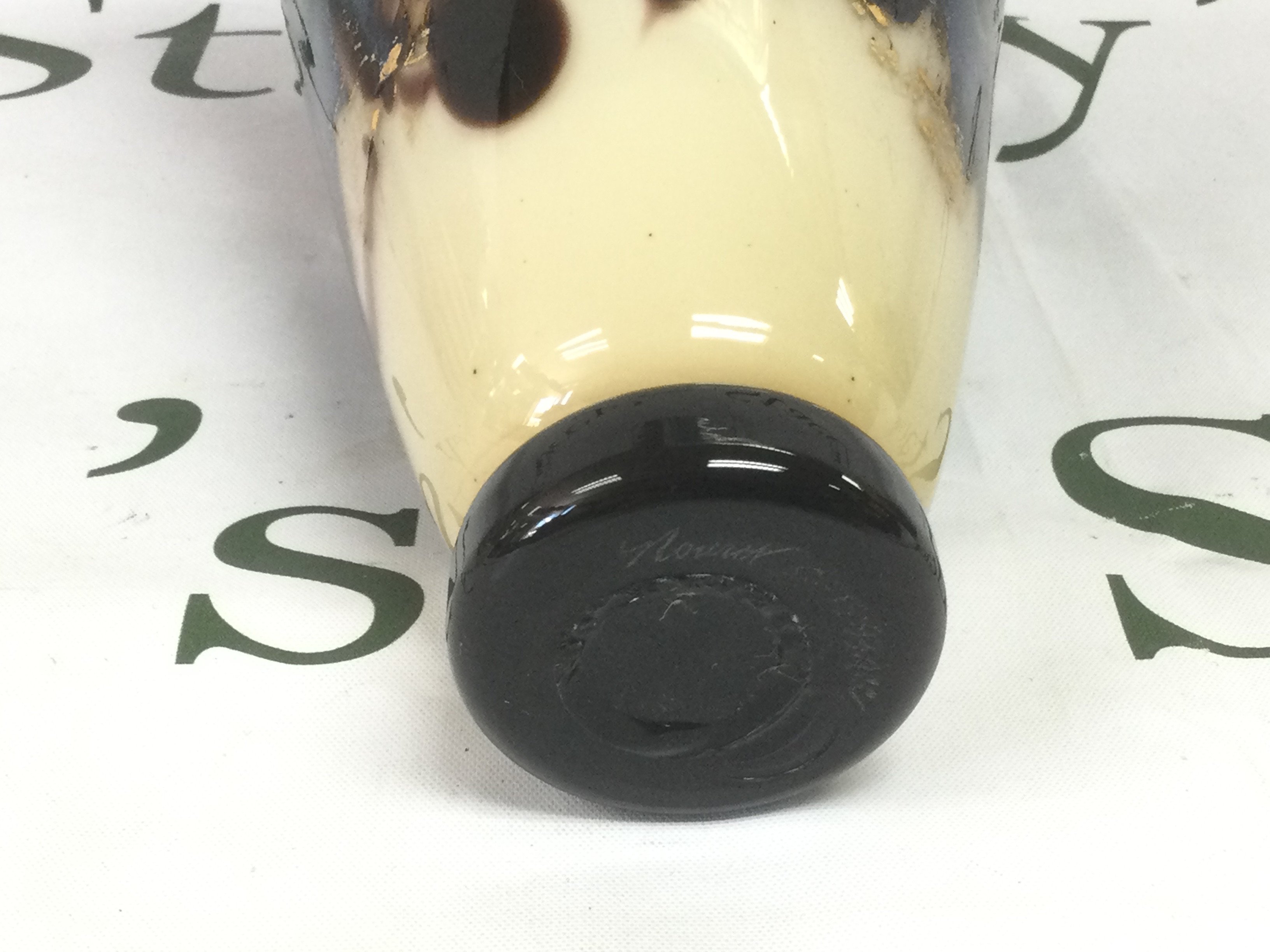 A Michael Nourot art glass vase with flared rim and a mottled iridescent glaze, approx height 22cm. Shipping category D.