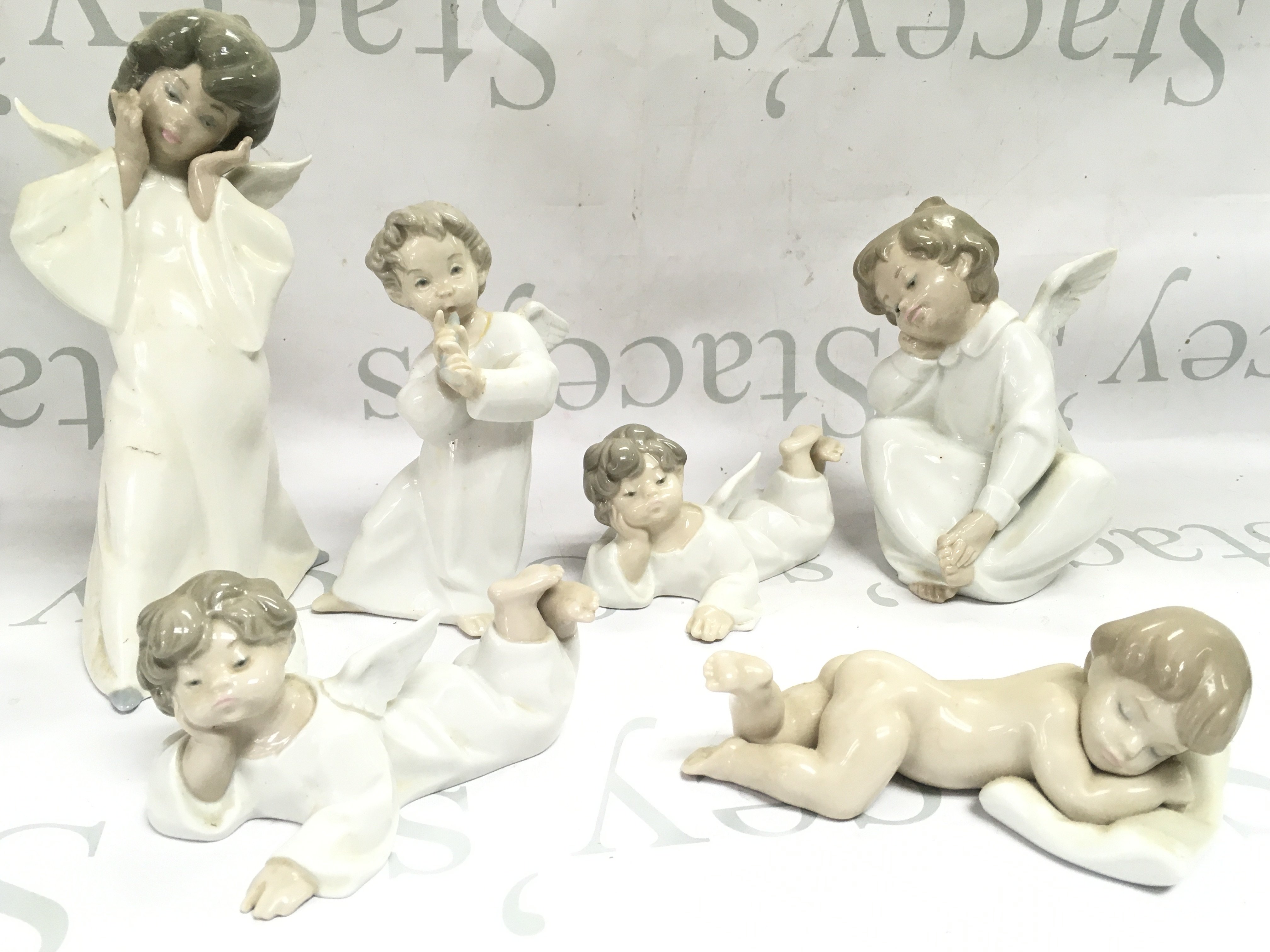Six Lladro porcelain figures , this lot cannot be posted