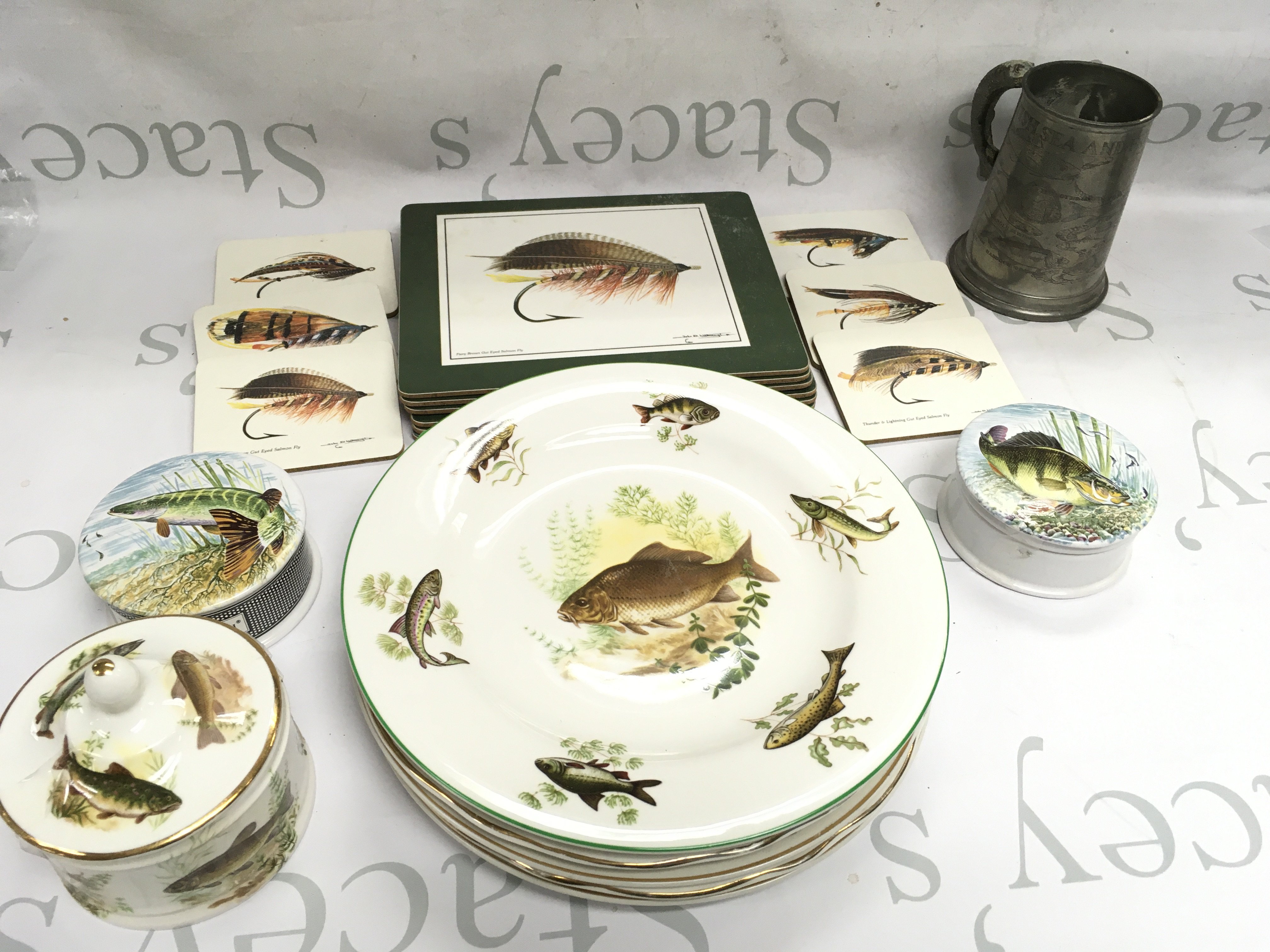 Bethany Fish plates and salmon place mats , fishing tankard , porcelain fish design containers . This lot cannot be posted