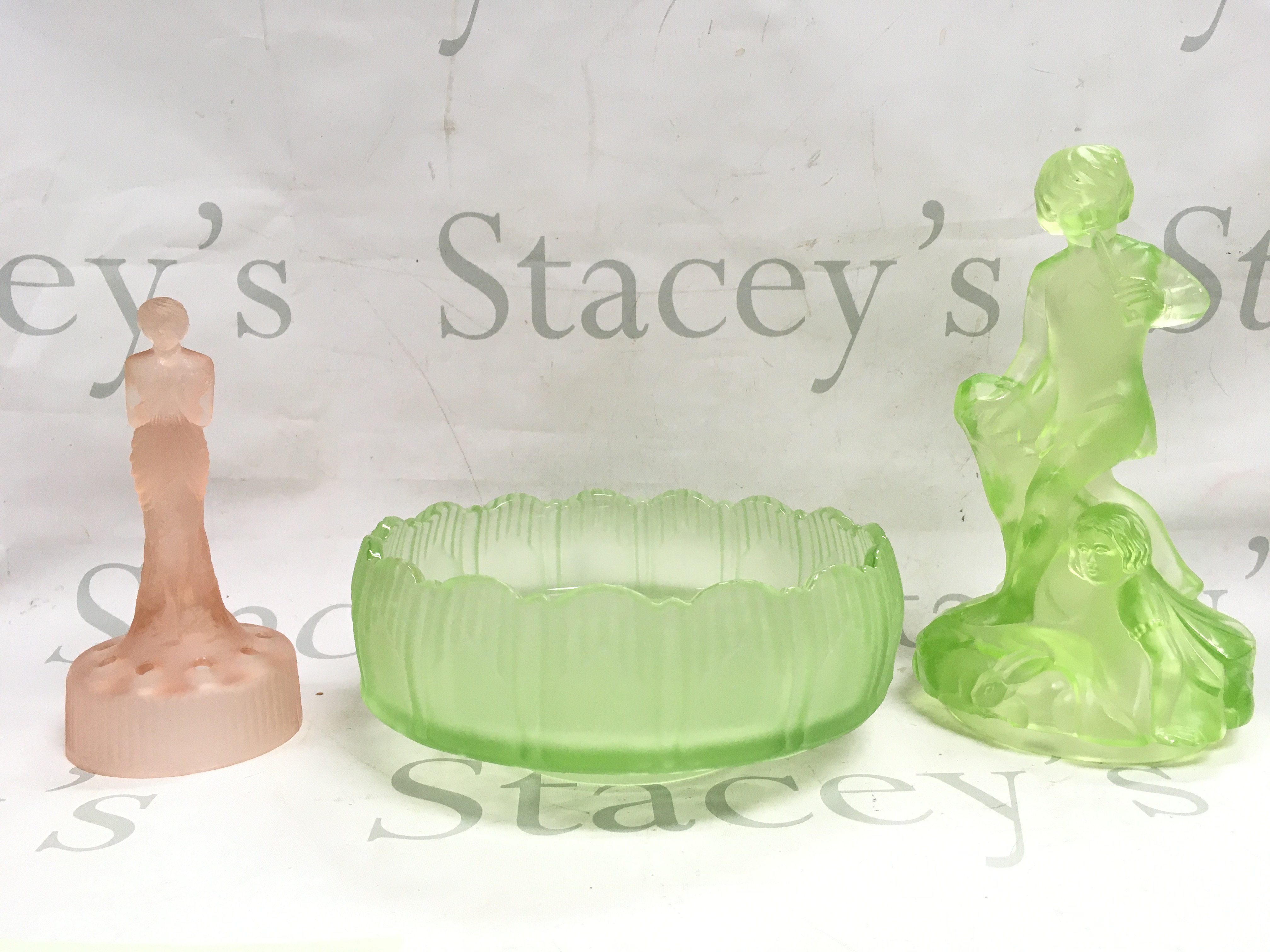 Collection of Art deco glass including a bowl 20 cm wide ,frosted pink glass nude lady figure and a Peter Pan uranium glass figure 24cm tall approximately. This lot cannot be posted