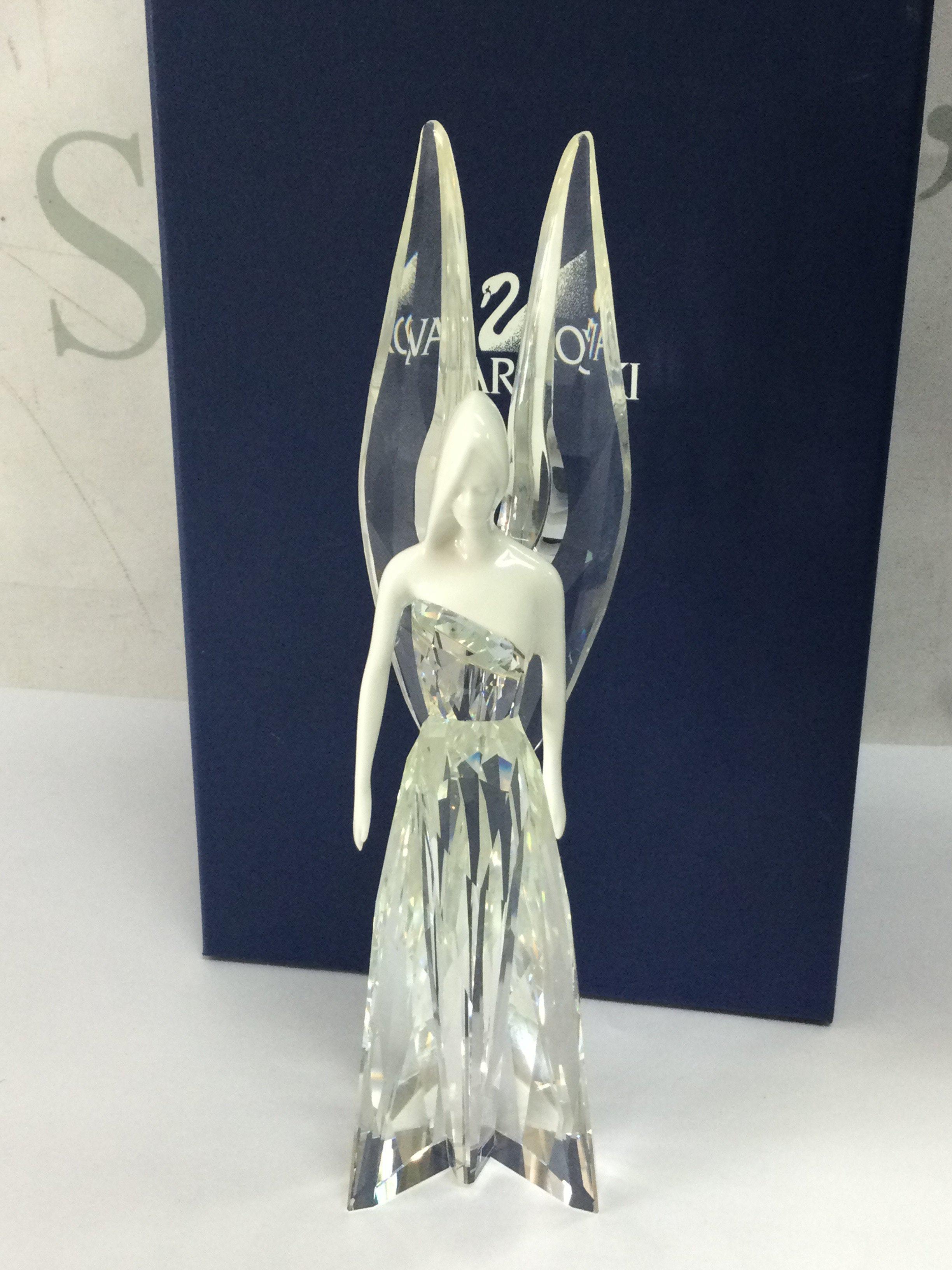A boxed Swarovski crystal glass angel Adrienne figure. No obvious damage or restoration.This lot cannot be posted