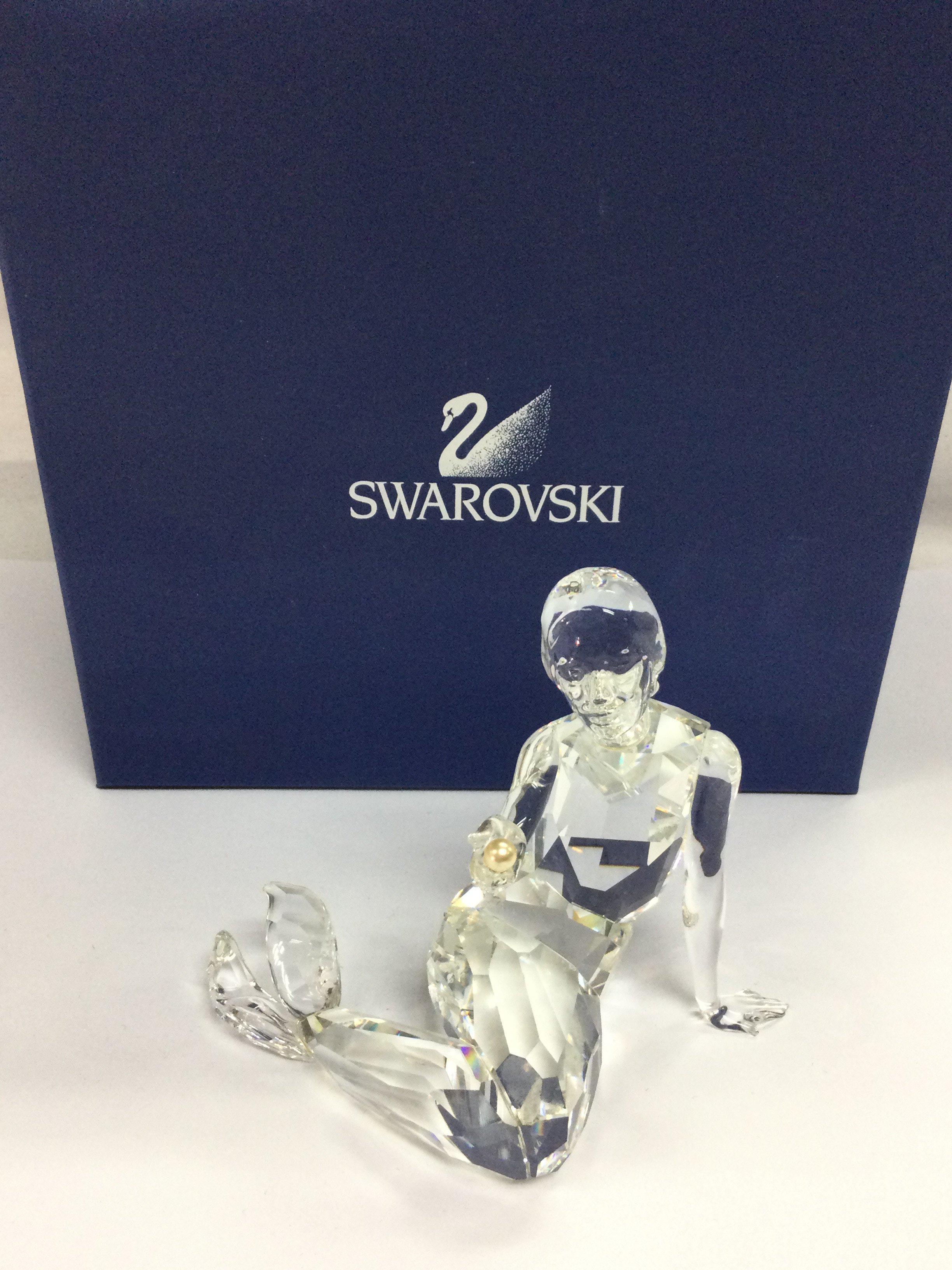 A boxed Swarovski Crystal glass Mermaid with pearl figure . This lot cannot be posted
