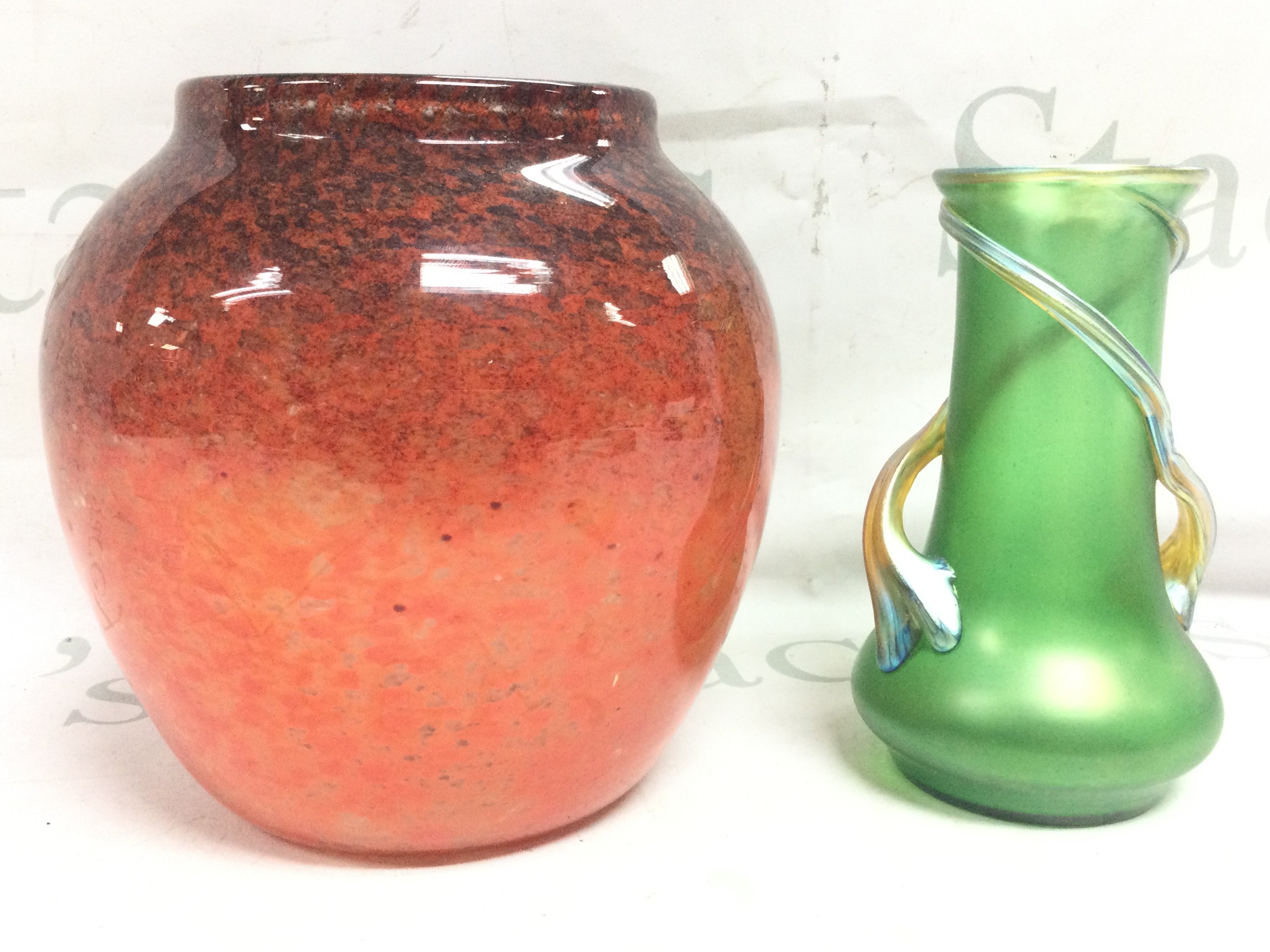 A Loetz style vase circa 1900 (16cm tall) and one other art vase (18Cm tall). No obvious damage or restoration.This lot cannot be posted