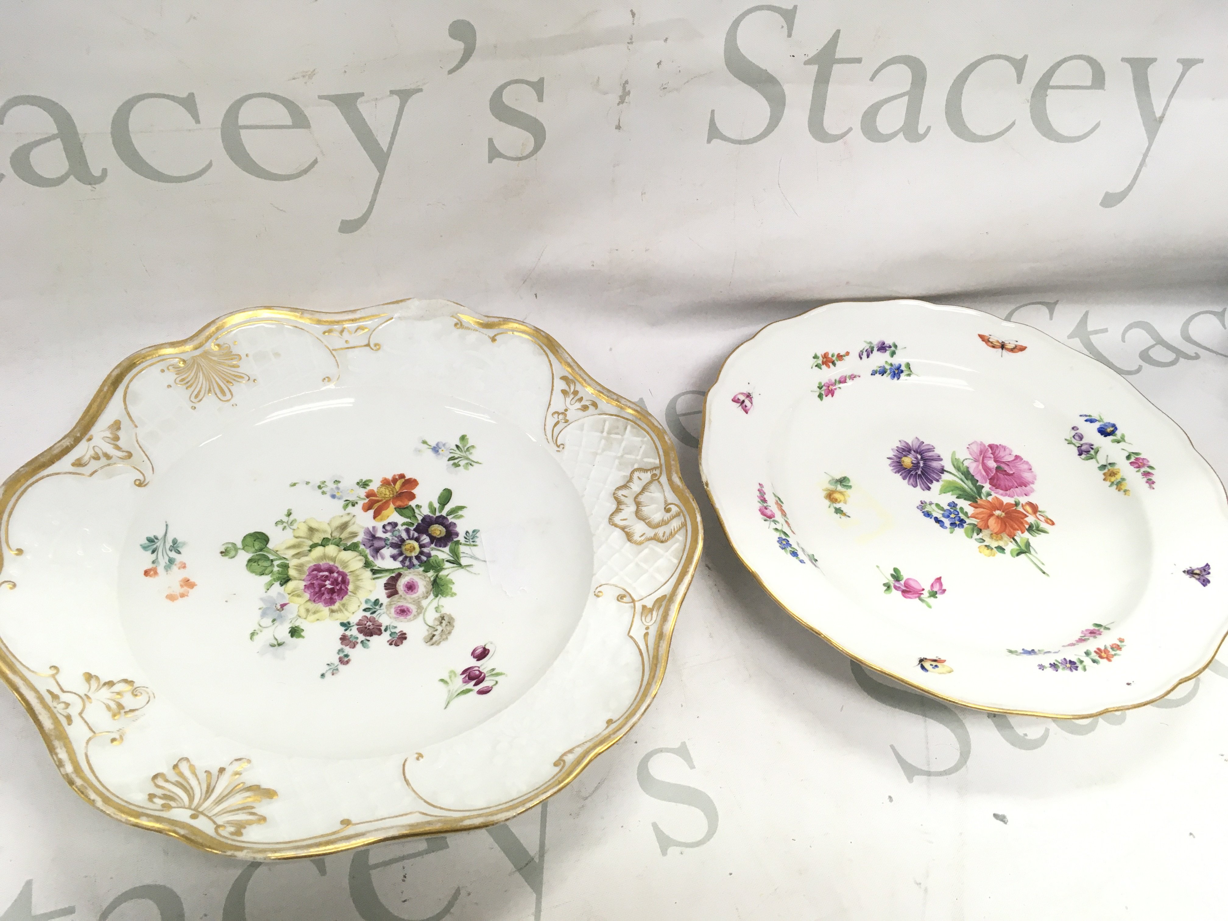 Two Meissen plates, signed on the base 26 and 24cm wide . This lot cannot be posted