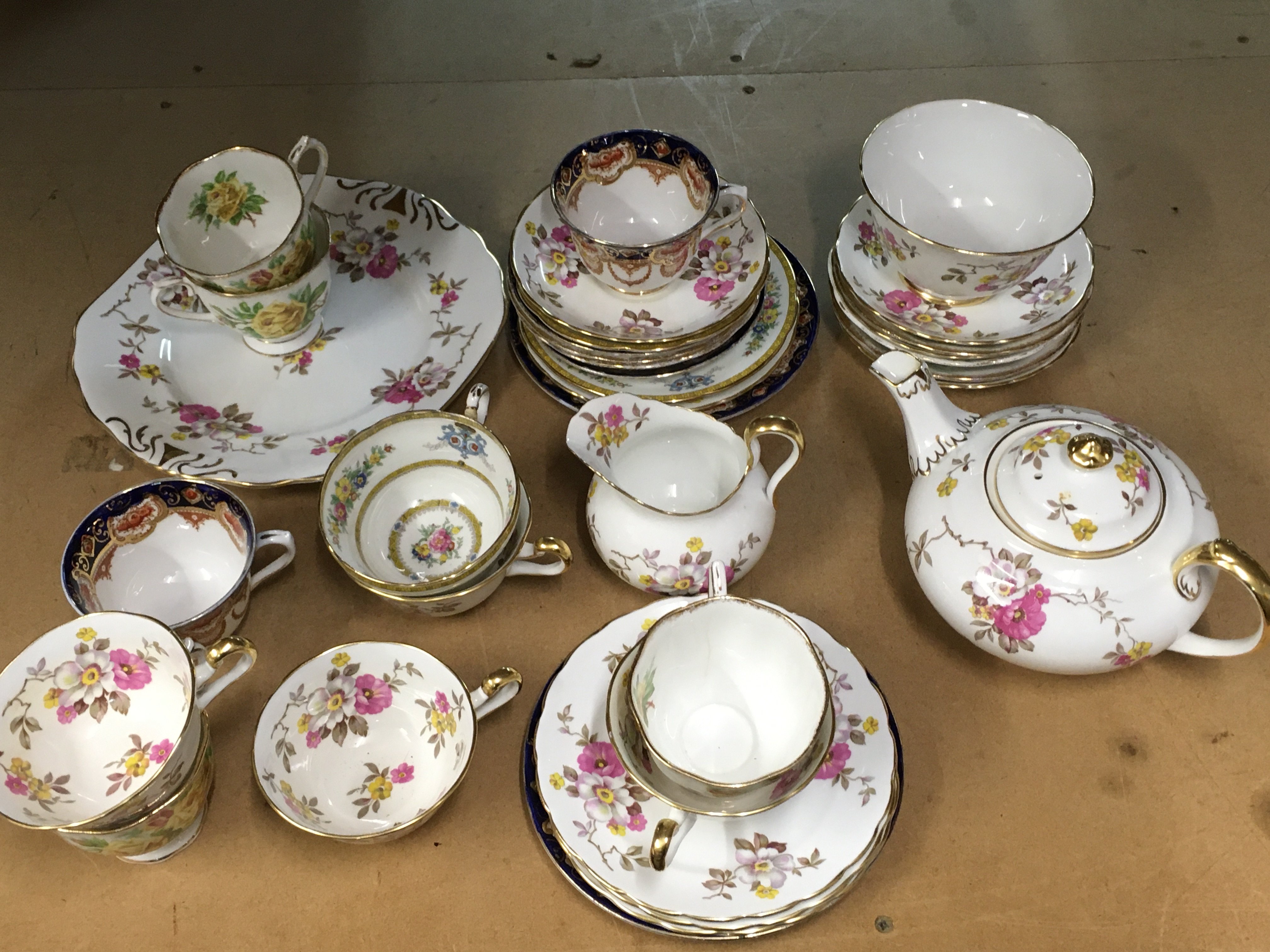 A Collection of various saucers and cups including Royal Albert Tea Rose, New Chelsea Staffs etc. this lot cannot be posted
