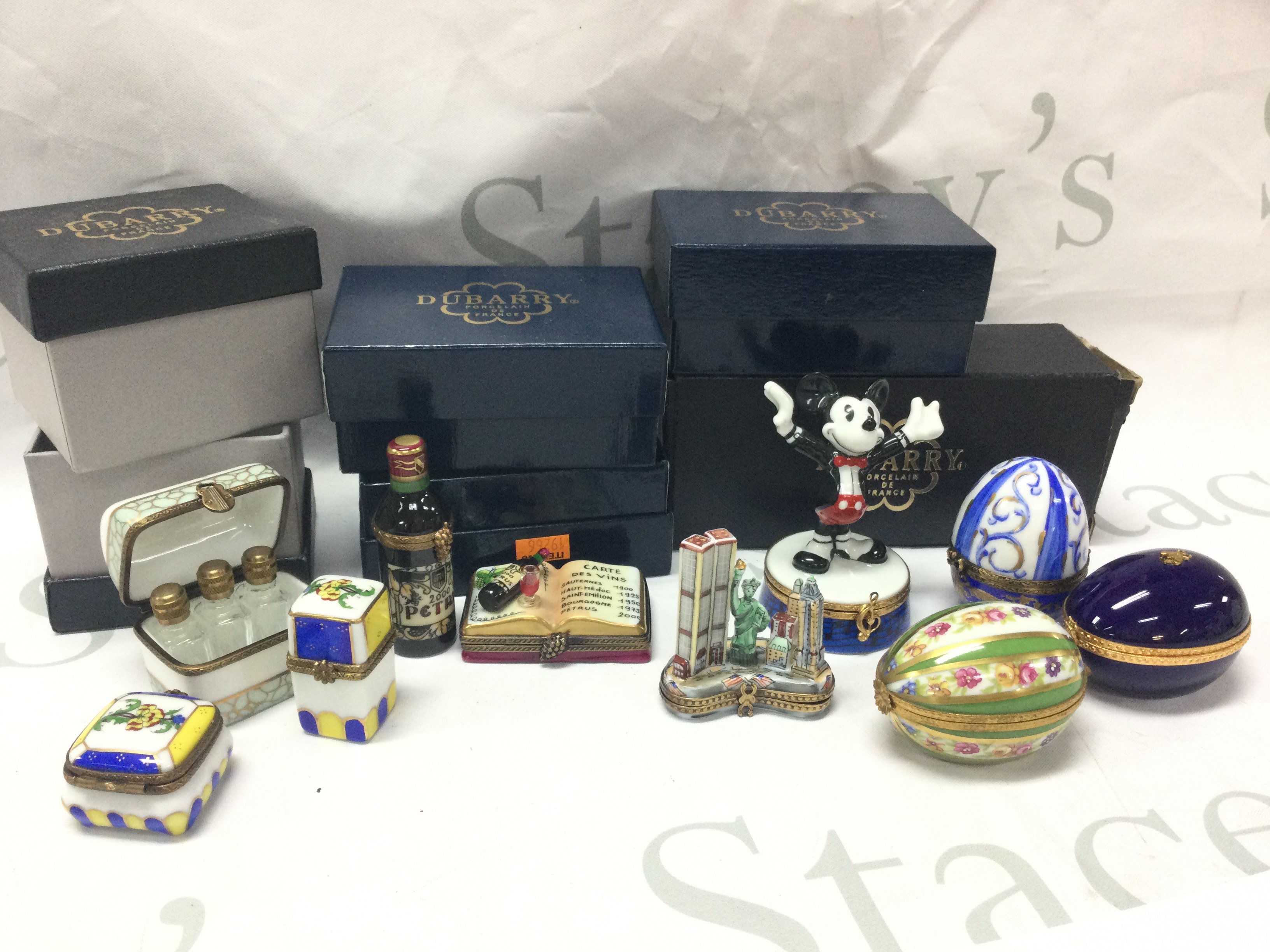 Boxed Dunbarry ceramic pill boxes including Mickey Mouse box, Petrvs bottle, eggs. This lot cannot be posted