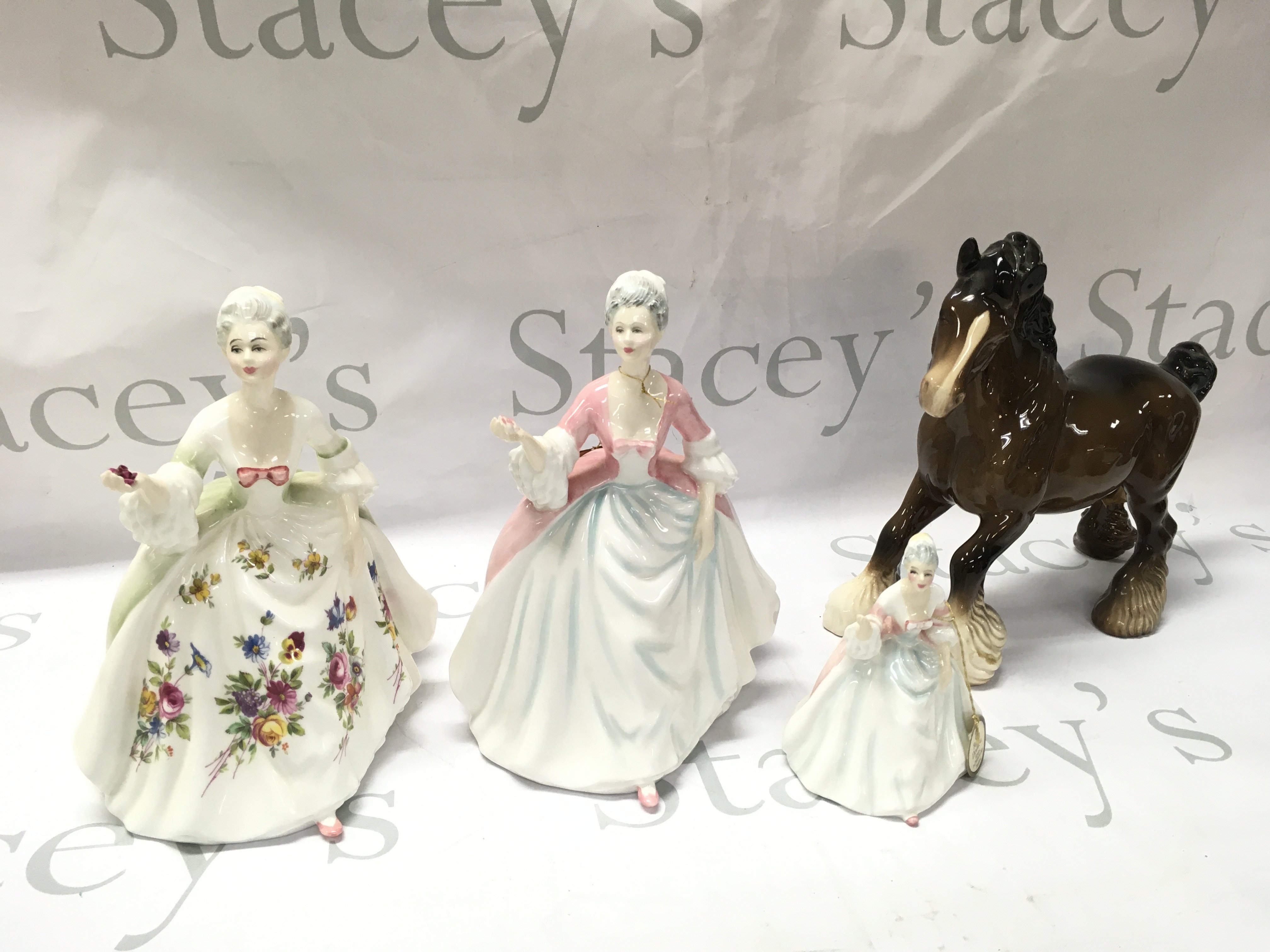 Royal Doulton Diana porcelain figures and a Beswick horse. This lot cannot be posted
