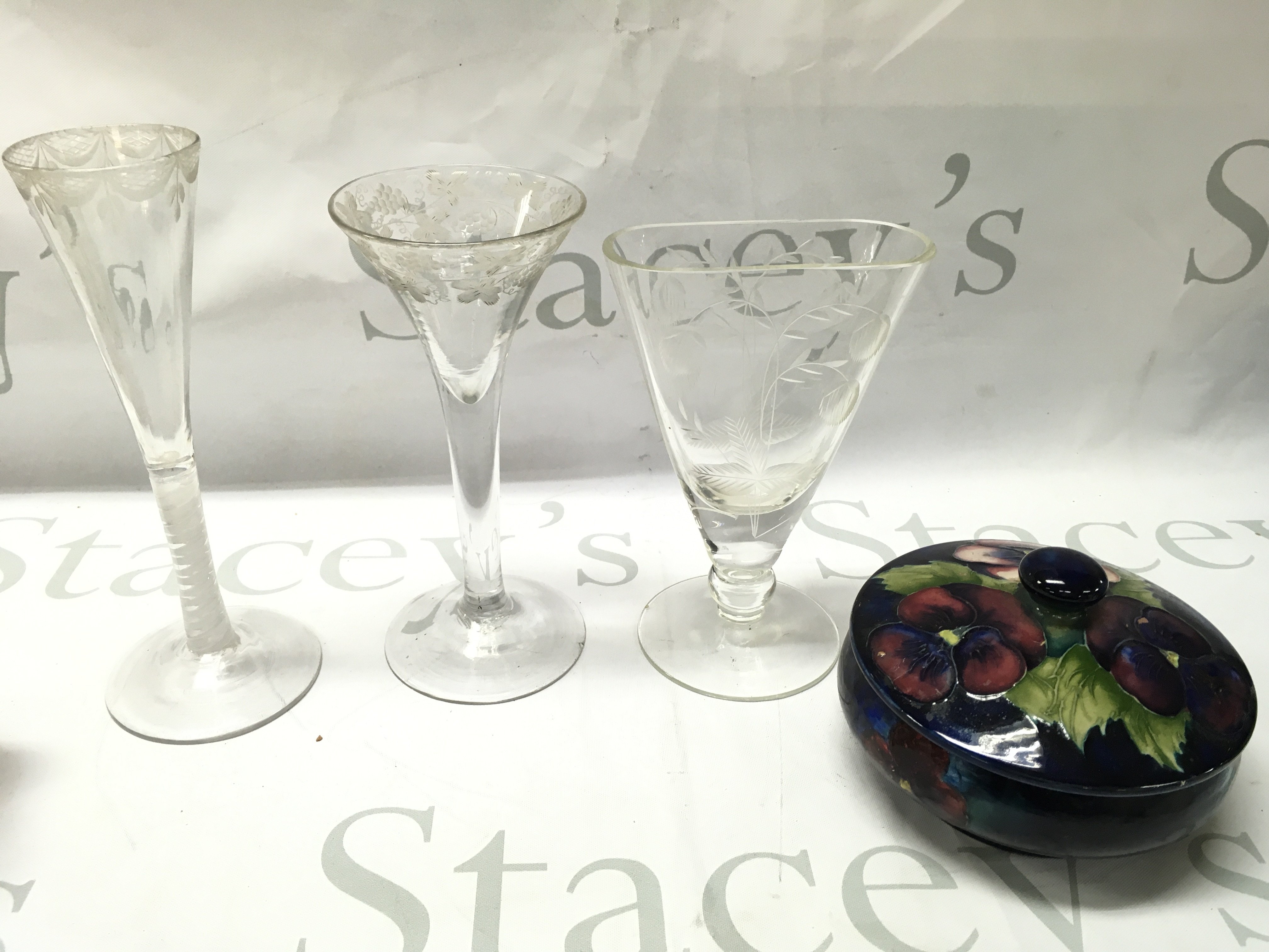 Three 18th century glasses , a Moorcroft jar with cover . This lot cannot be posted