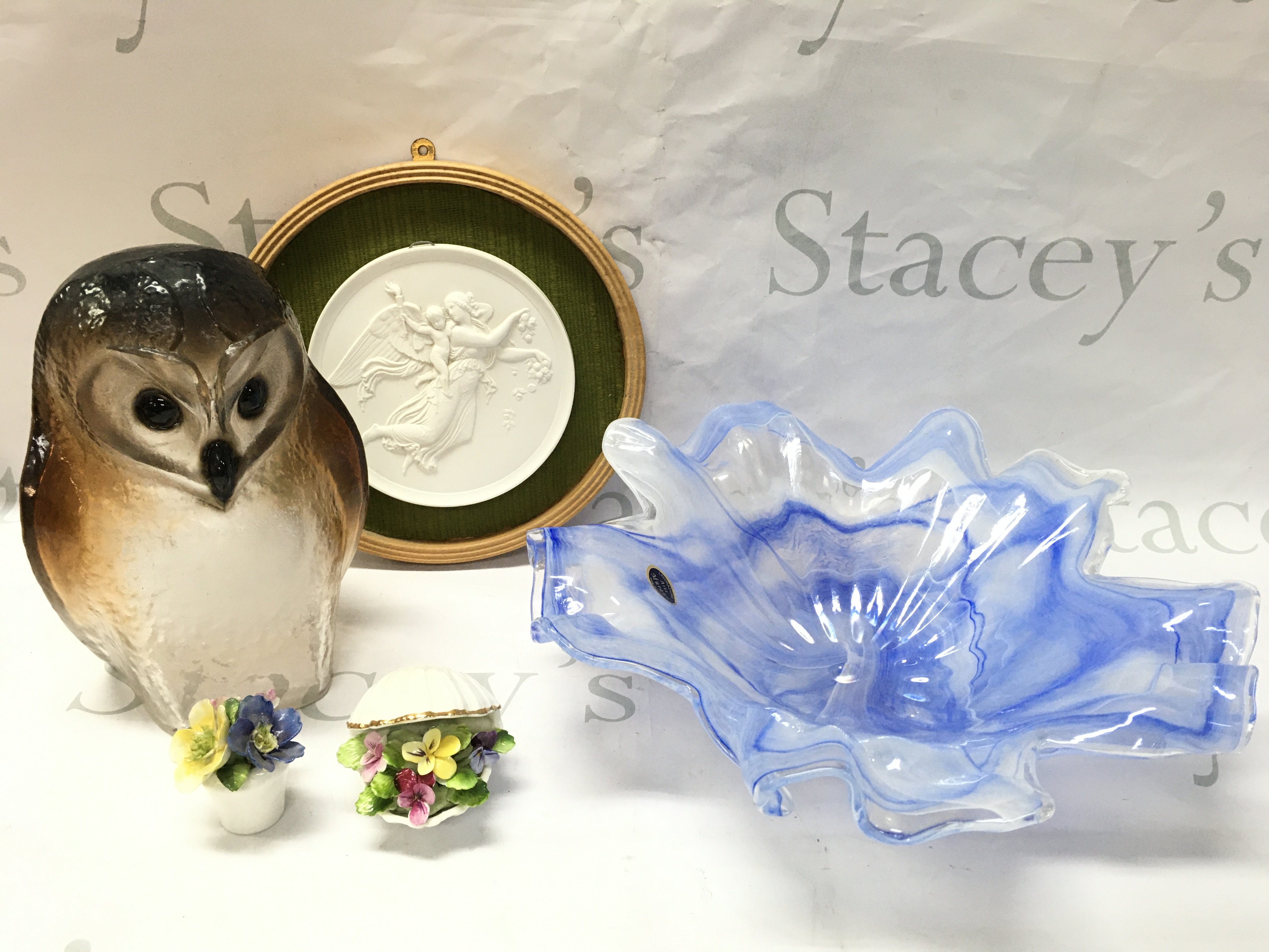 A Collection of art glass including a Lavorazione Arte Murano dish, Maleras Swedish owl, Royal Copenhagen bisque angel and cherub plaque, ceramic flower baskets . This lot cannot be posted