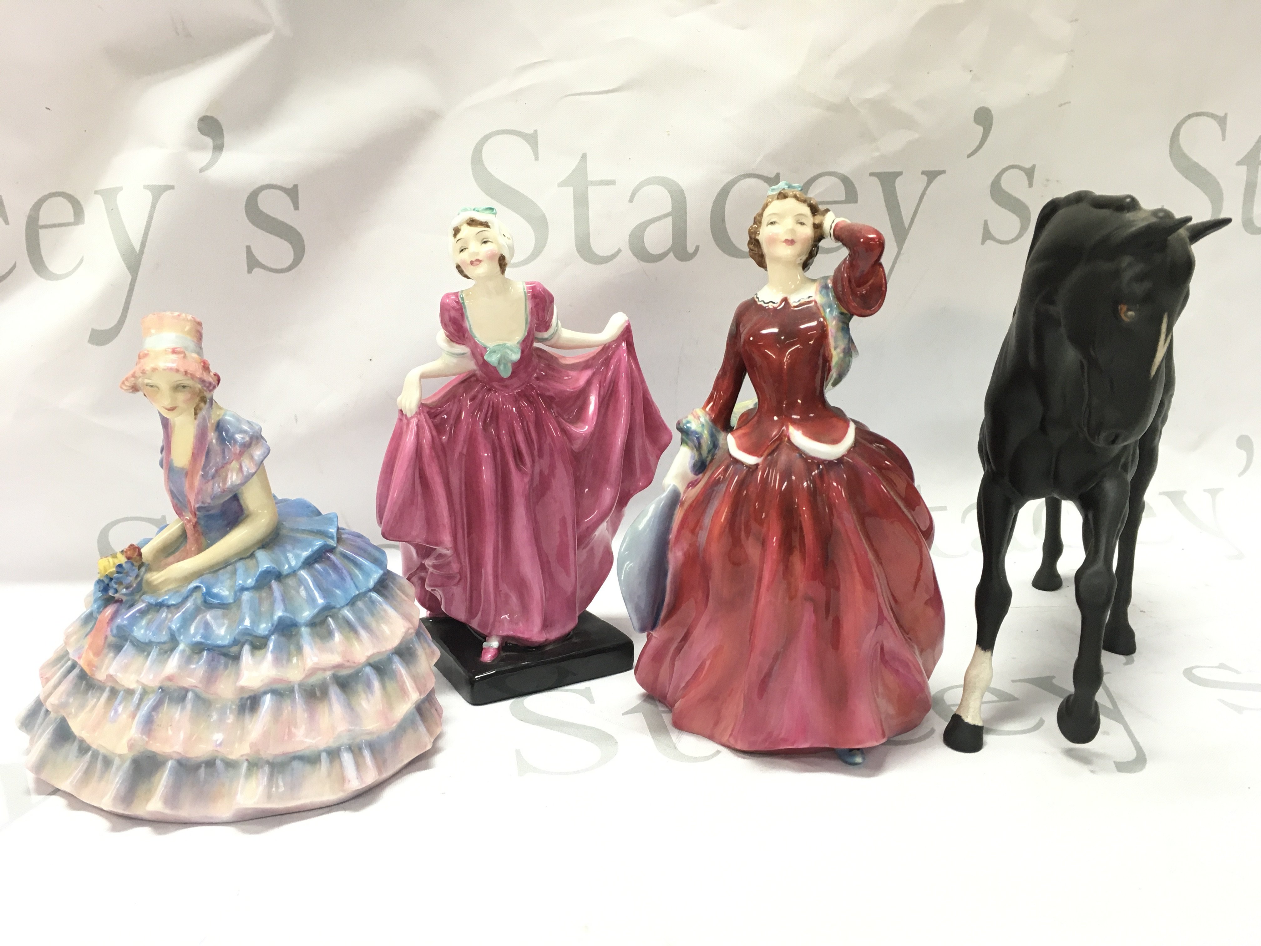 A Collection of Royal Doulton figures including Chloe, Delight, Blithe Morning, Black Horse. This lot cannot be posted
