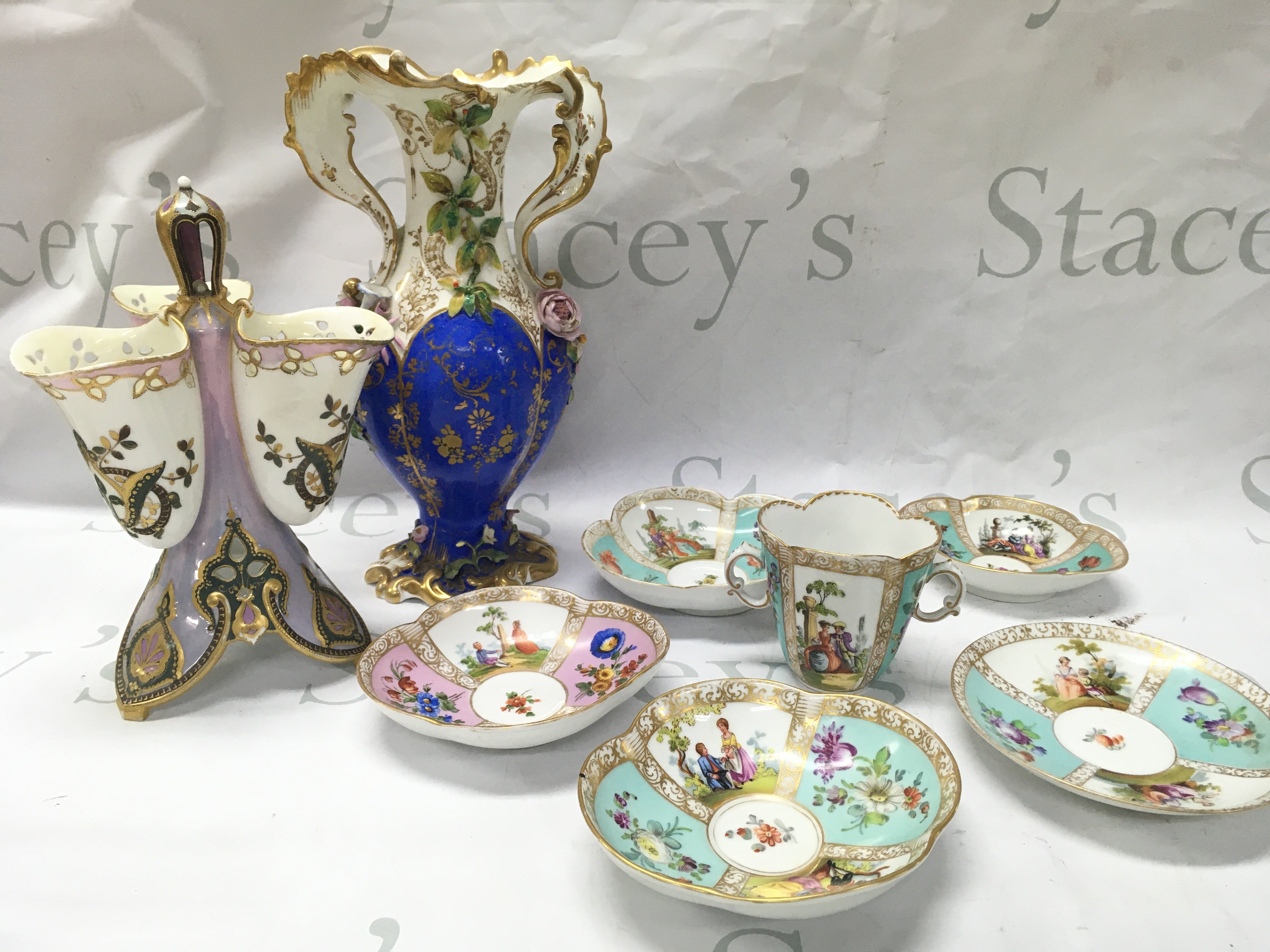 Porcelain French Pearlescent glaze and gilted vase , a restored and damaged English Cobalt , white , gilted and Floral design vase (28cm tall), Dresden dishes and cup decorated with figural scenes and floral imagery. This lot cannot be posted