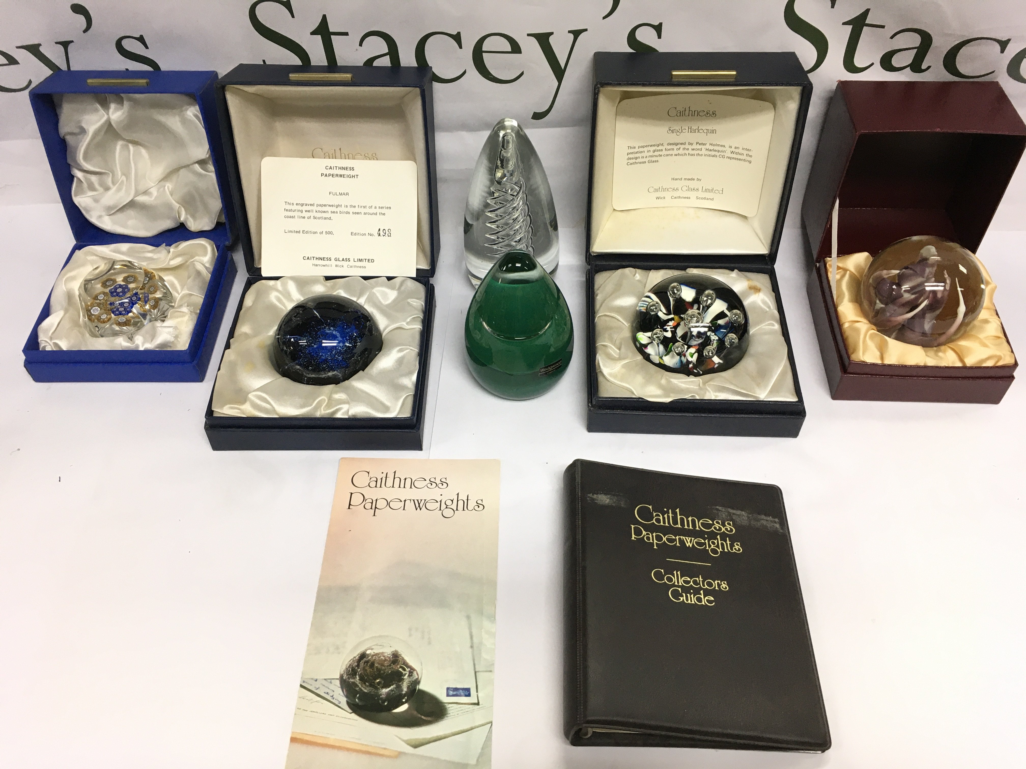 Six glass paperweights comprising g four boxed examples including two Caithness paperweights, one being a limited edition. Shipping category D.