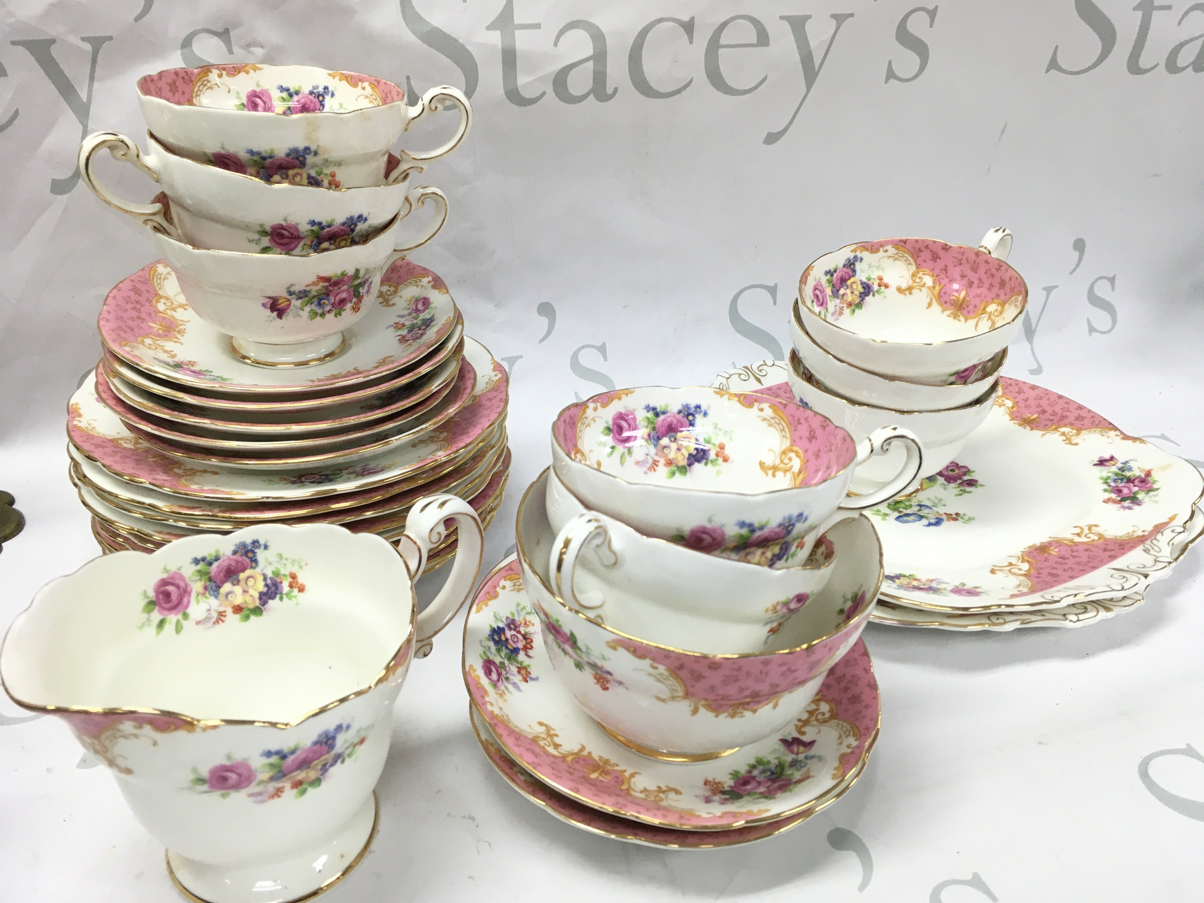 A pink Paragon tea set including saucers, cups . This lot cannot be posted