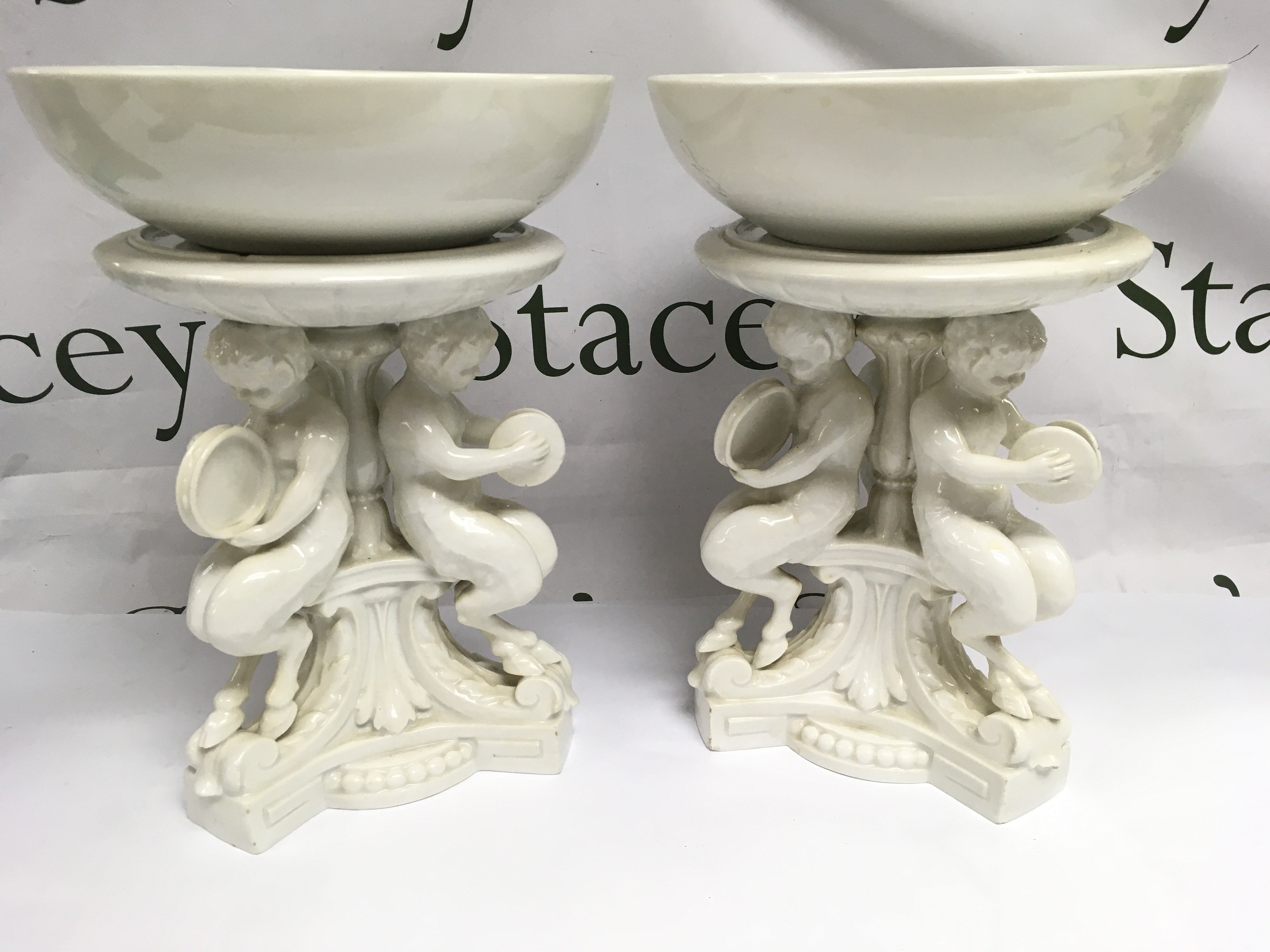 A pair of Meissen blanc de chine figural comports, approx height 28cm. Shipping category D.