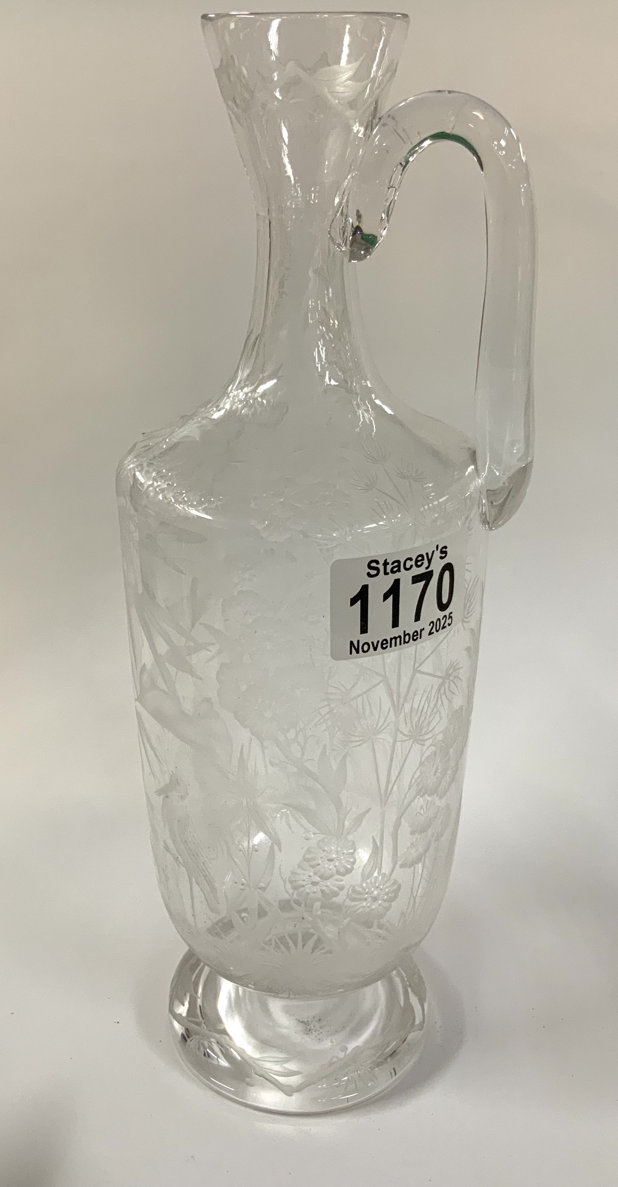 A fine etched glass decanter with views of storks amongst reeds, 28cm (no stopper)