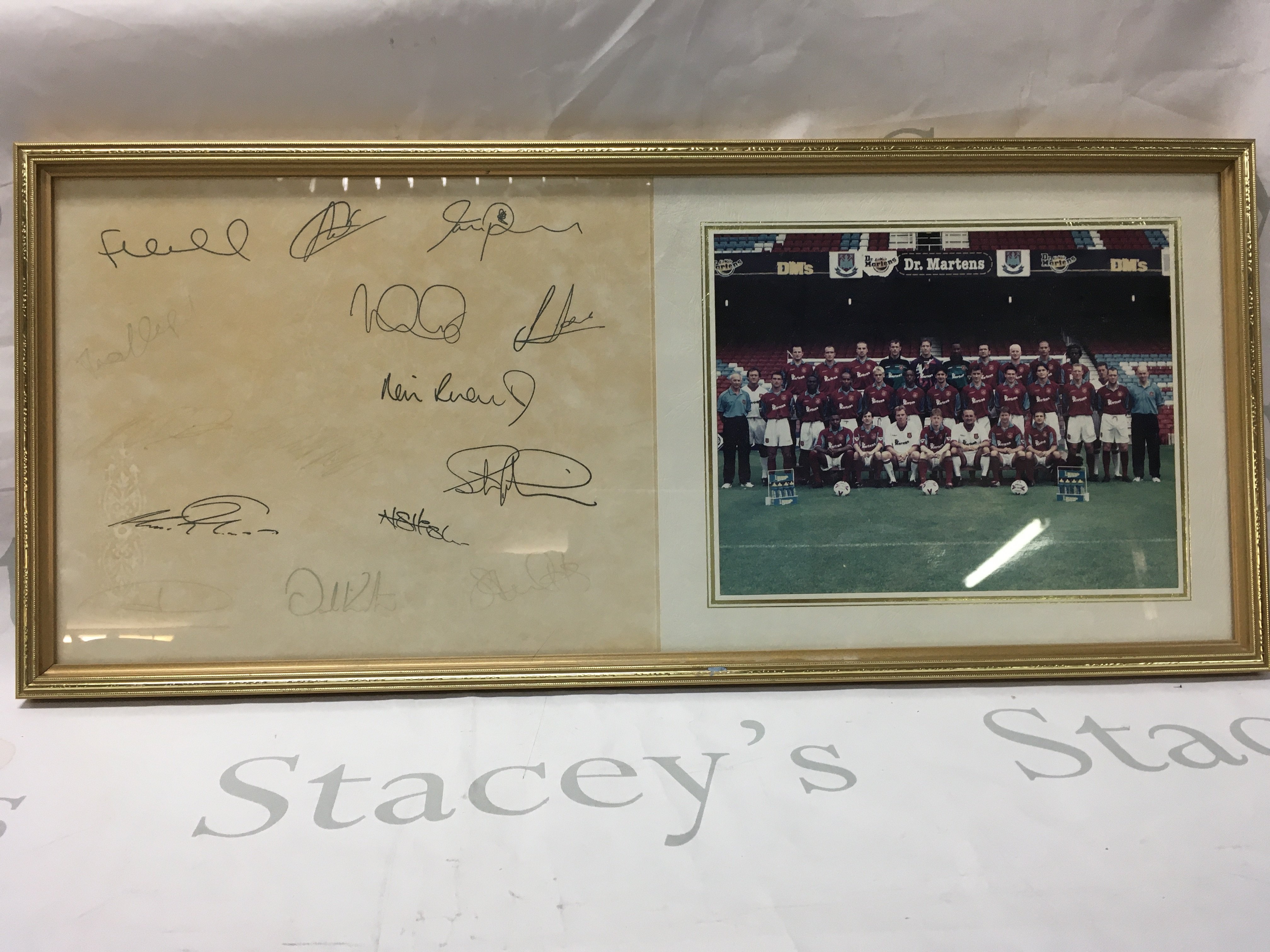A signed West Ham team photo. Approx 64CM x 28CM.